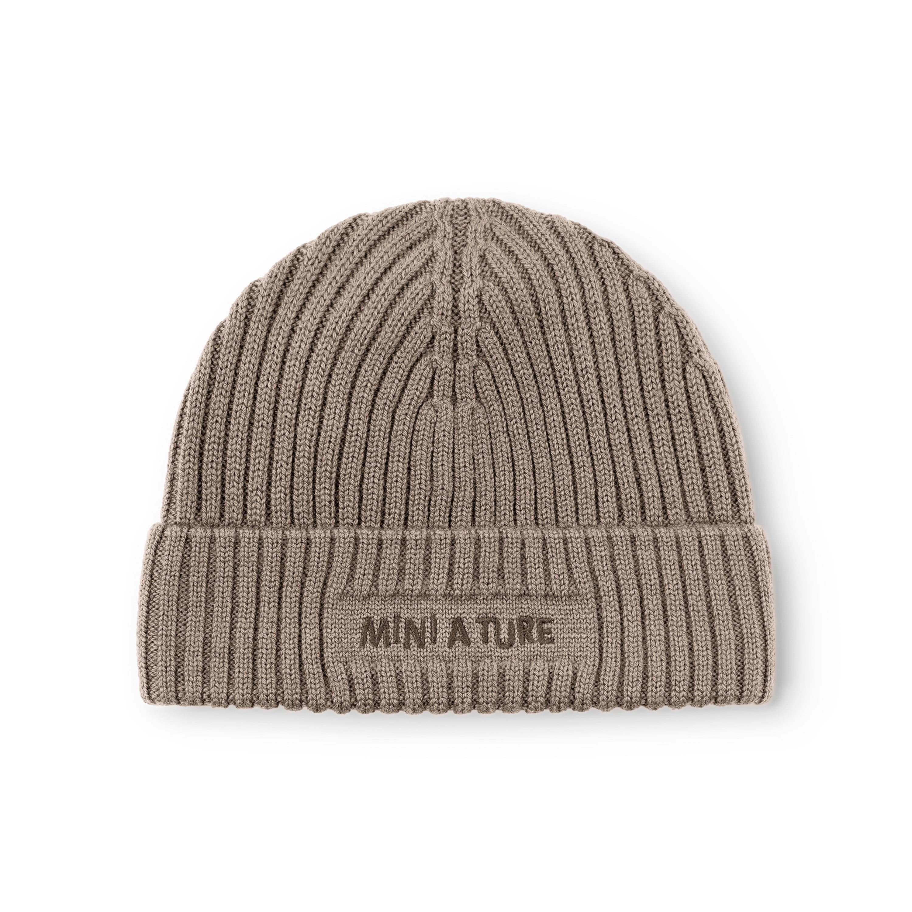 MATBOJE fleece lined beanie in taupe merino wool with the fold-up brim positioned to show the embroidered MINI A TURE logo and the ribbed knit detail across the front and crown.