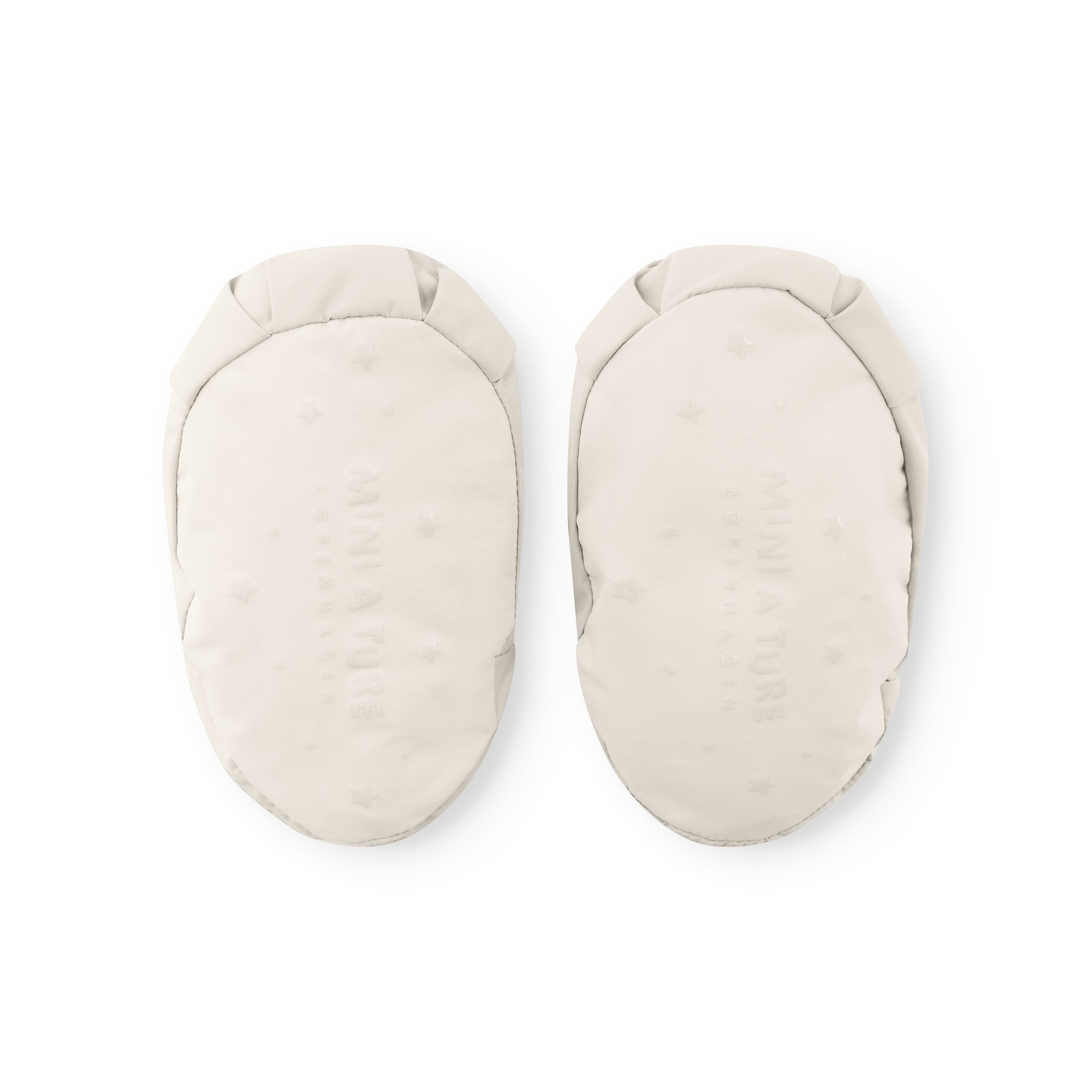 MATWINN insulated baby outdoor socks in off-white shown from the sole, displaying the smooth recycled polyamide base with embossed MINI A TURE branding and elasticated ankle opening designed for warmth during pram outings.