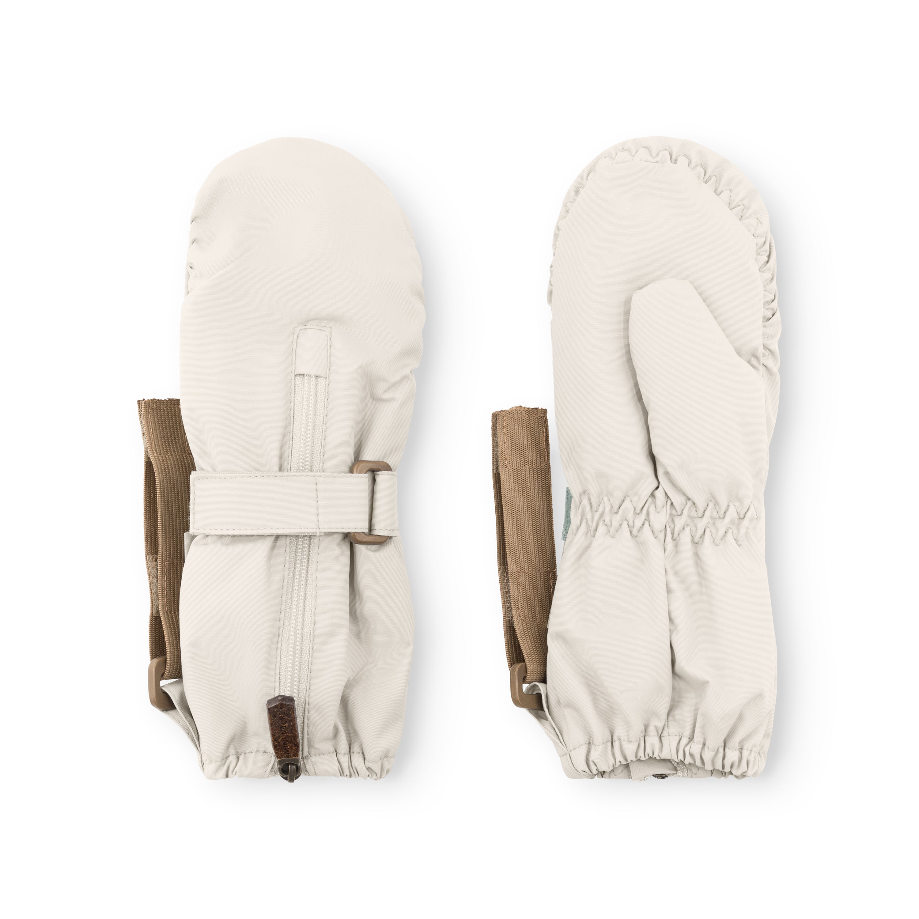 MATCESAR waterproof mittens in cream shown from front and back, featuring the full-length zip with metal pull and velcro tab, elastic gathered cuffs with visible stitching detail, beige webbing strap with D-ring and velcro fastening, and the smooth recycled polyamide outer against a white background.