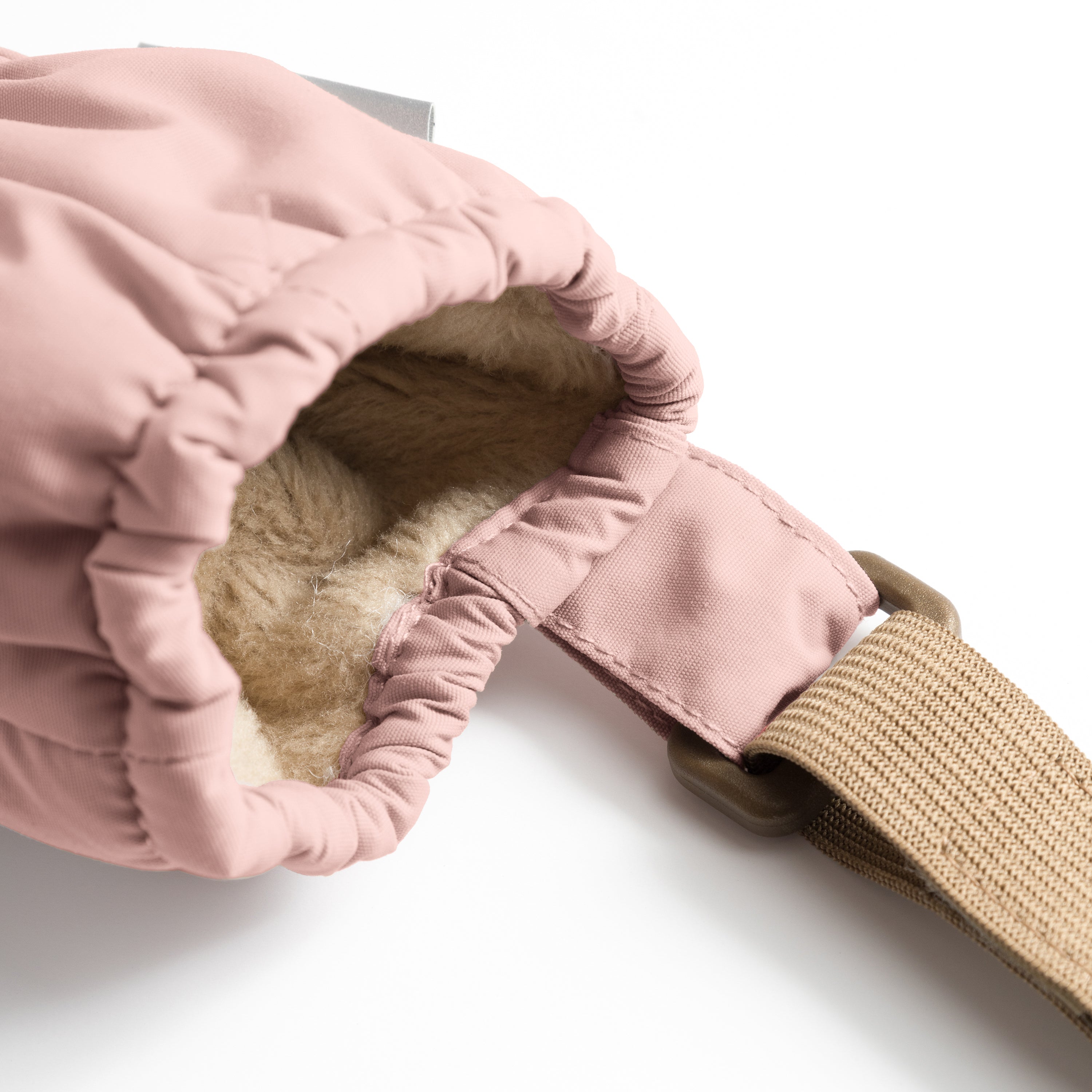 MATCORDT fleece lined mittens in pale pink shown from the interior with the cuff folded back, revealing the soft beige fleece lining, THINSULATE padding and the elastic gathered construction that seals out cold air at the wrist.