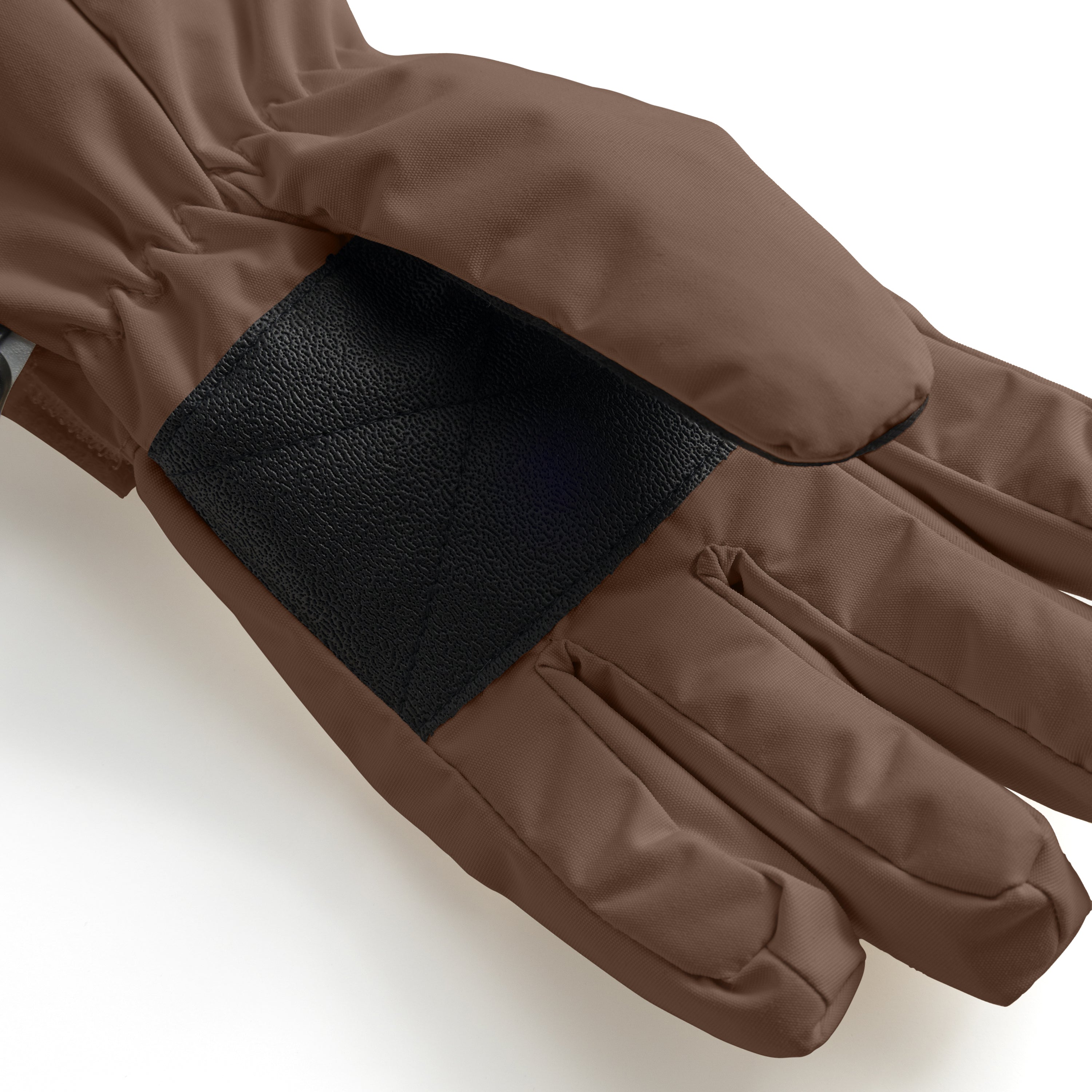 MATCELIO gloves in warm brown photographed in close-up to show the black elasticated wrist cuff positioned inside the extended brown cuff, demonstrating the dual-layer construction that seals out cold air and snow during winter wear.