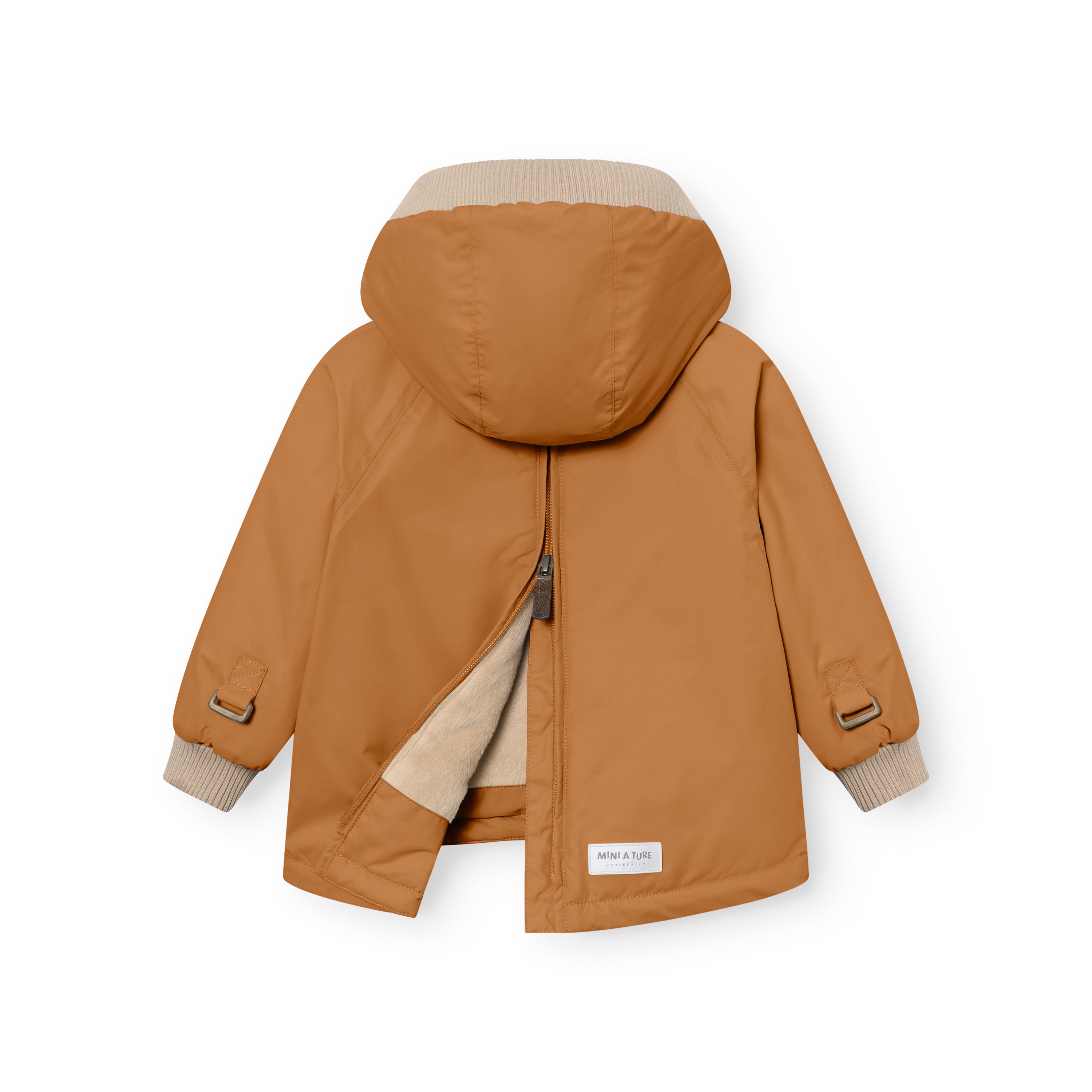 MATBABYWEN anorak in warm caramel brown viewed from the back with the full-length zip partially open, exposing the beige fleece lining and illustrating the flat-opening design that simplifies dressing, with raglan sleeves, adjustable wrist tabs with metal buckles, and a white MINI A TURE label visible at the lower hem.