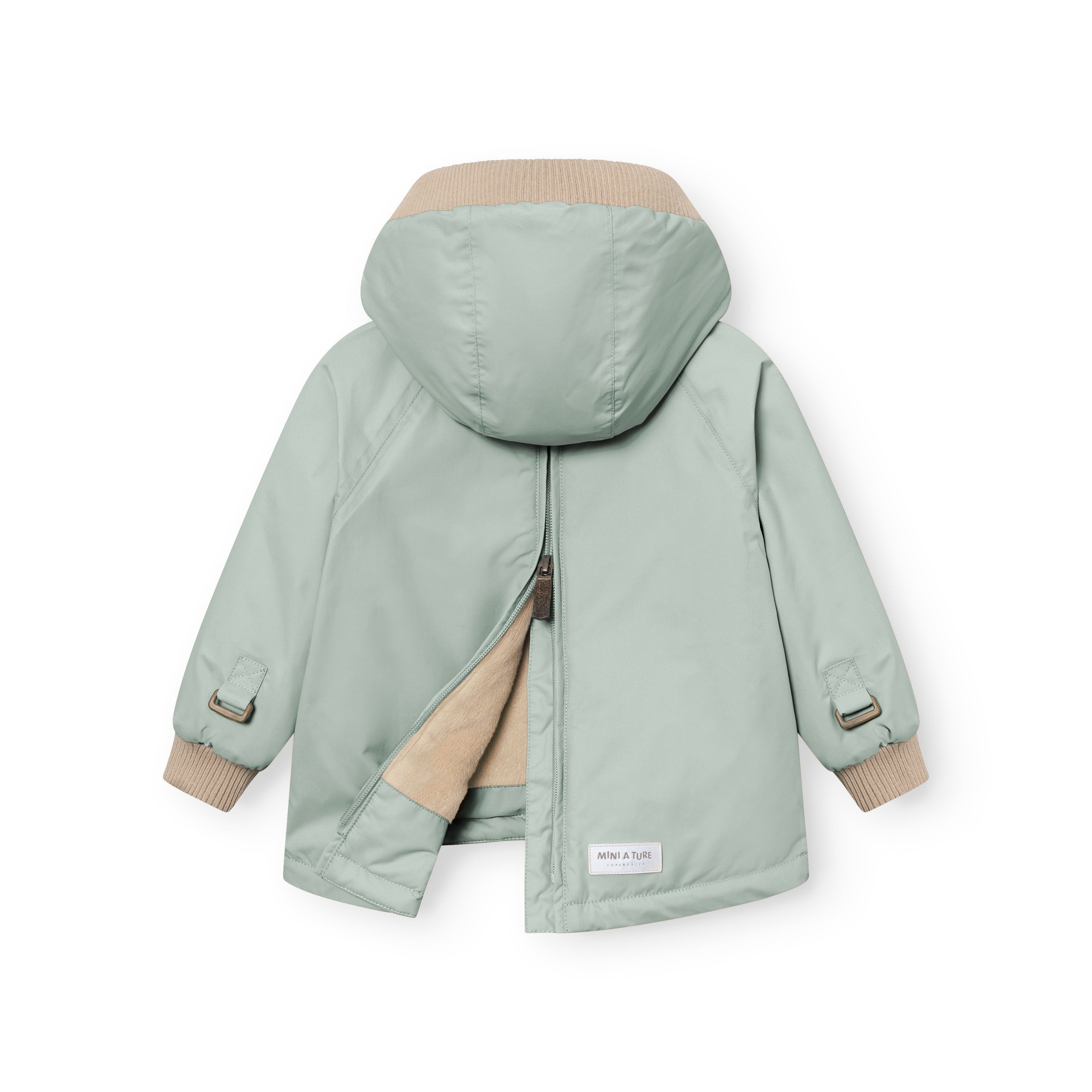 MATBABYWEN anorak in pale green shown from the back with the full-length zip partially open, revealing the beige fleece lining and demonstrating how the coat opens flat for easier dressing, with adjustable sleeve tabs and beige ribbed hood and cuffs visible.