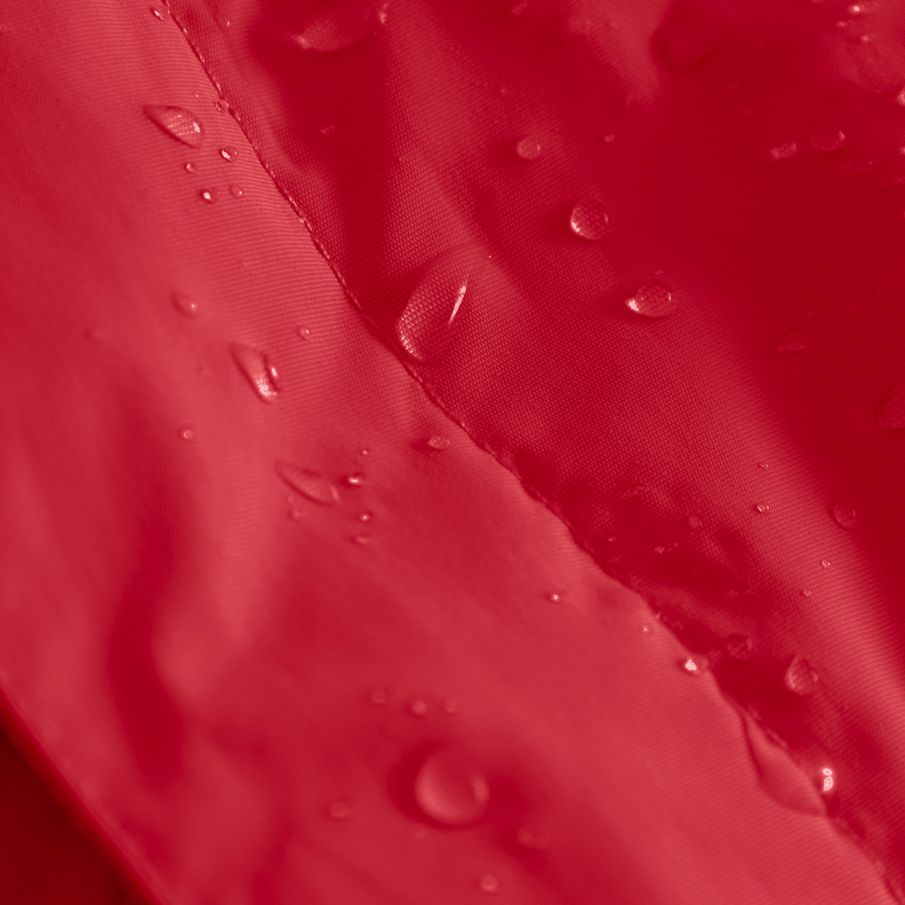 Close-up of water droplets beading on the red waterproof recycled nylon shell of the MATWANG fleece-lined winter jacket, demonstrating the fluorine-free Bionic Finish Eco treatment's water-repellent performance across the fabric surface and stitched seam.