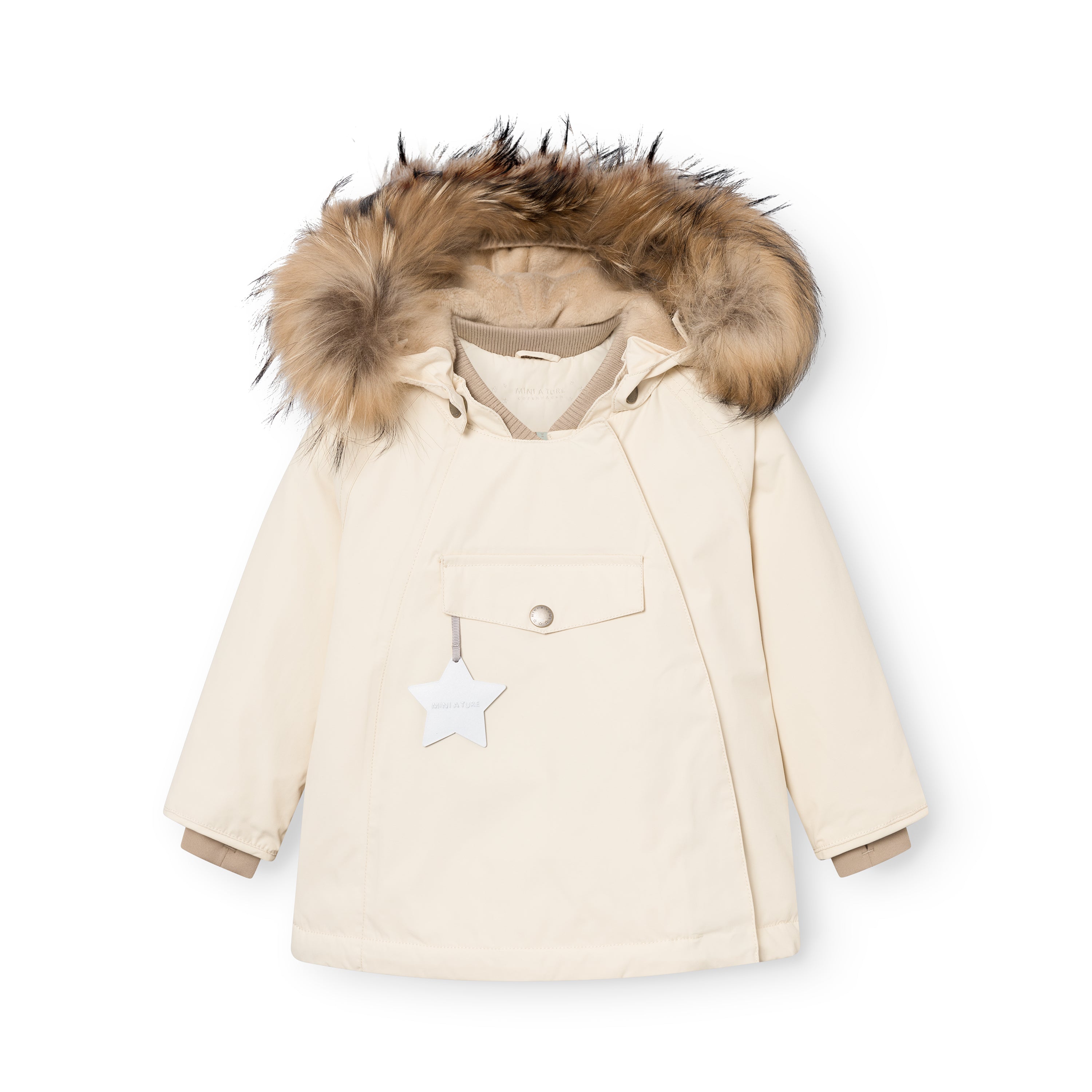 MATWANG fleece lined winter jacket in cream with a detachable real fur hood, beige ribbed collar, white reflective star zip pull on the chest pocket, press-stud placket concealing the slanted zip, and beige fleece lining visible at the cuffs.