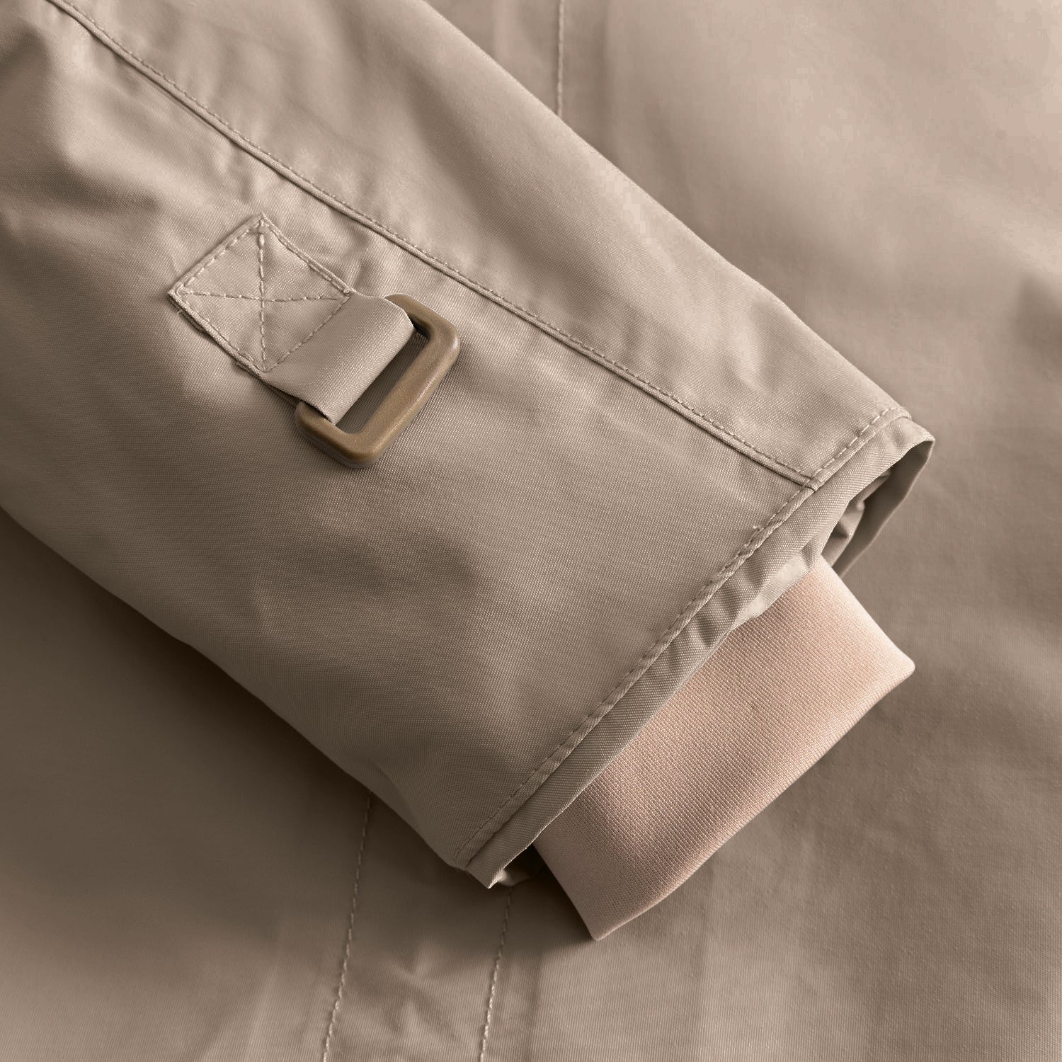 Close-up of the MATWALLY fleece lined winter jacket cuff in taupe, showing the adjustable snow cuff with hook-and-loop fastening tab and beige inner cuff, demonstrating the thumb opening detail and fully taped seam construction.