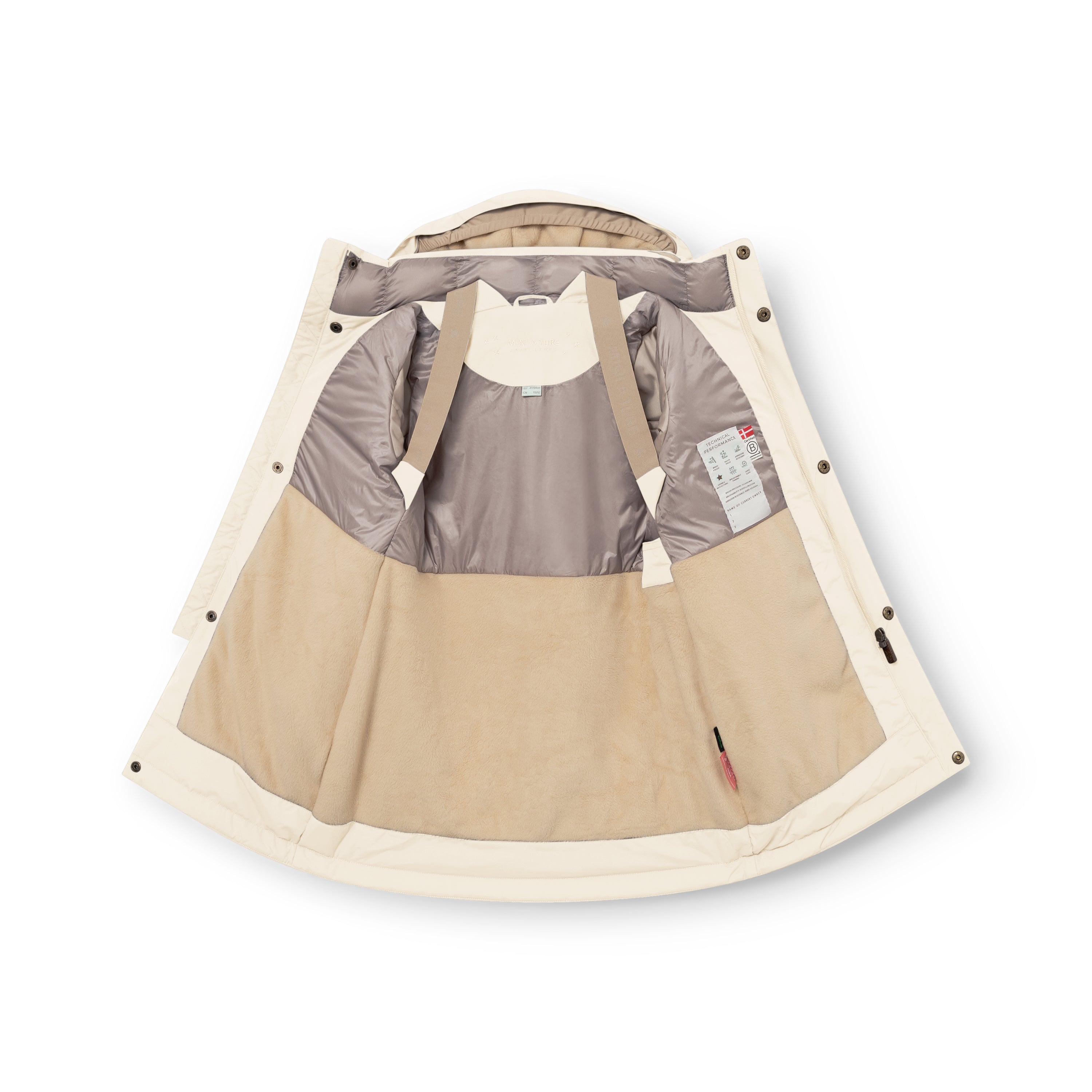 MATVENCASIA winter jacket in cream, photographed open and laid flat to reveal the beige internal suspenders, pale grey Sorona Aura padded upper lining, cream fleece lower lining, snap-button hood attachment points, and care label visible inside the left panel.