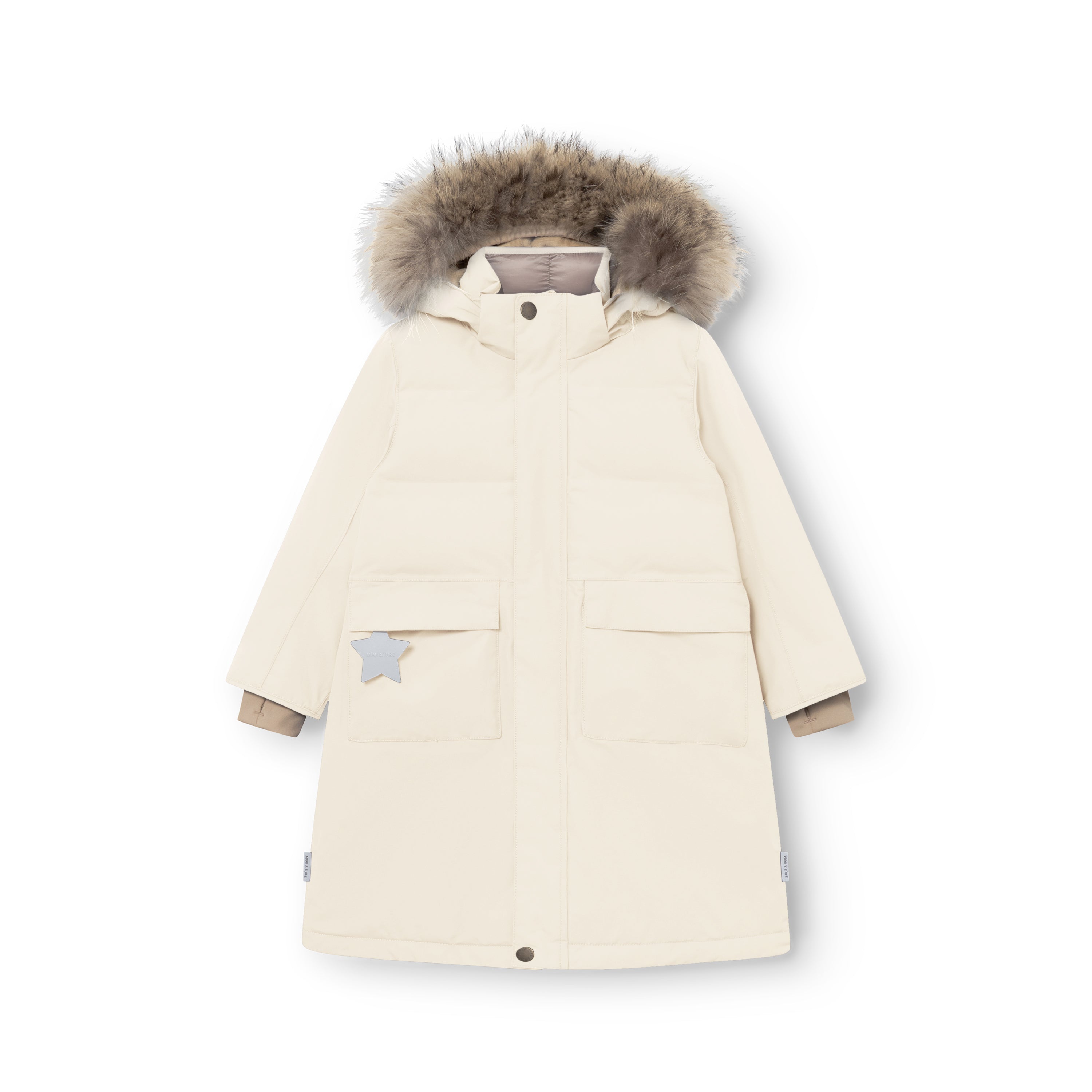 MATVENCASIA winter jacket in cream shown from the front, featuring the mid-thigh length, two large front pockets with flap closures, reflective star detail on the left pocket, snow cuffs at the wrists, and the detachable hood with genuine fur trim.