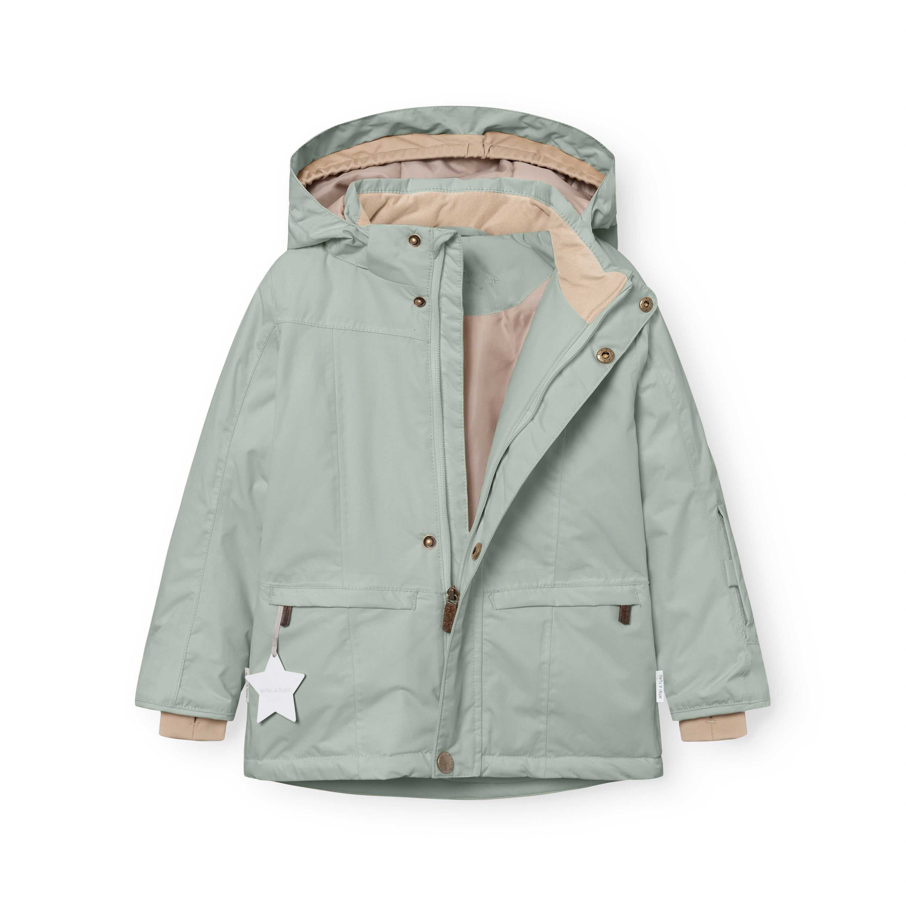 MATVESTYN winter jacket in sage green displayed open, revealing the light beige lining, snap-button front closure, ribbed beige cuffs, and a white star reflector hanging from the left pocket.