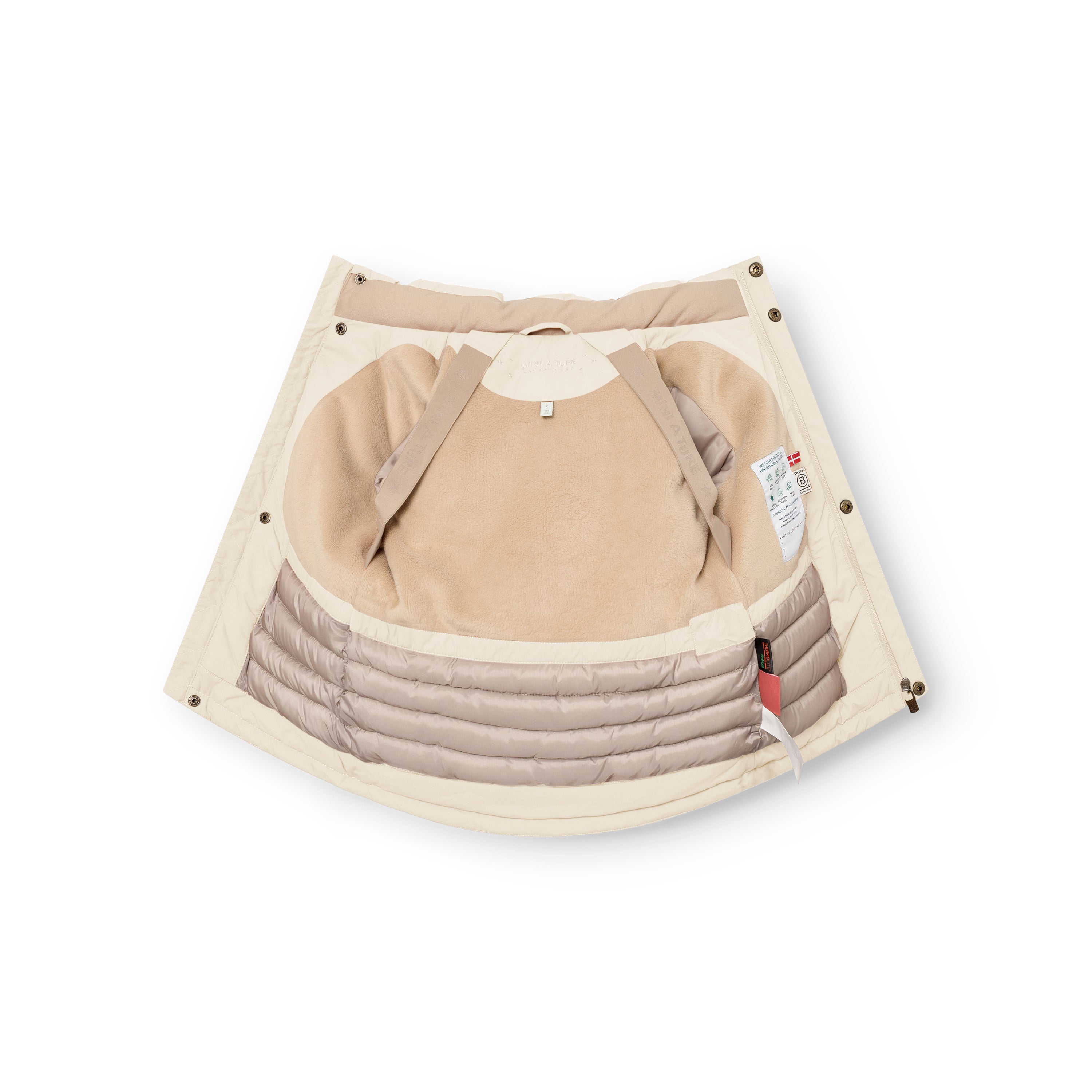 MATKASTORIO fleece lined winter jacket in cream, interior view laid open showing the beige fleece lining at the upper body, Sorona Aura padded lower section with horizontal quilting, internal suspenders with snap button fastenings at the shoulders and a care label visible on the right side.