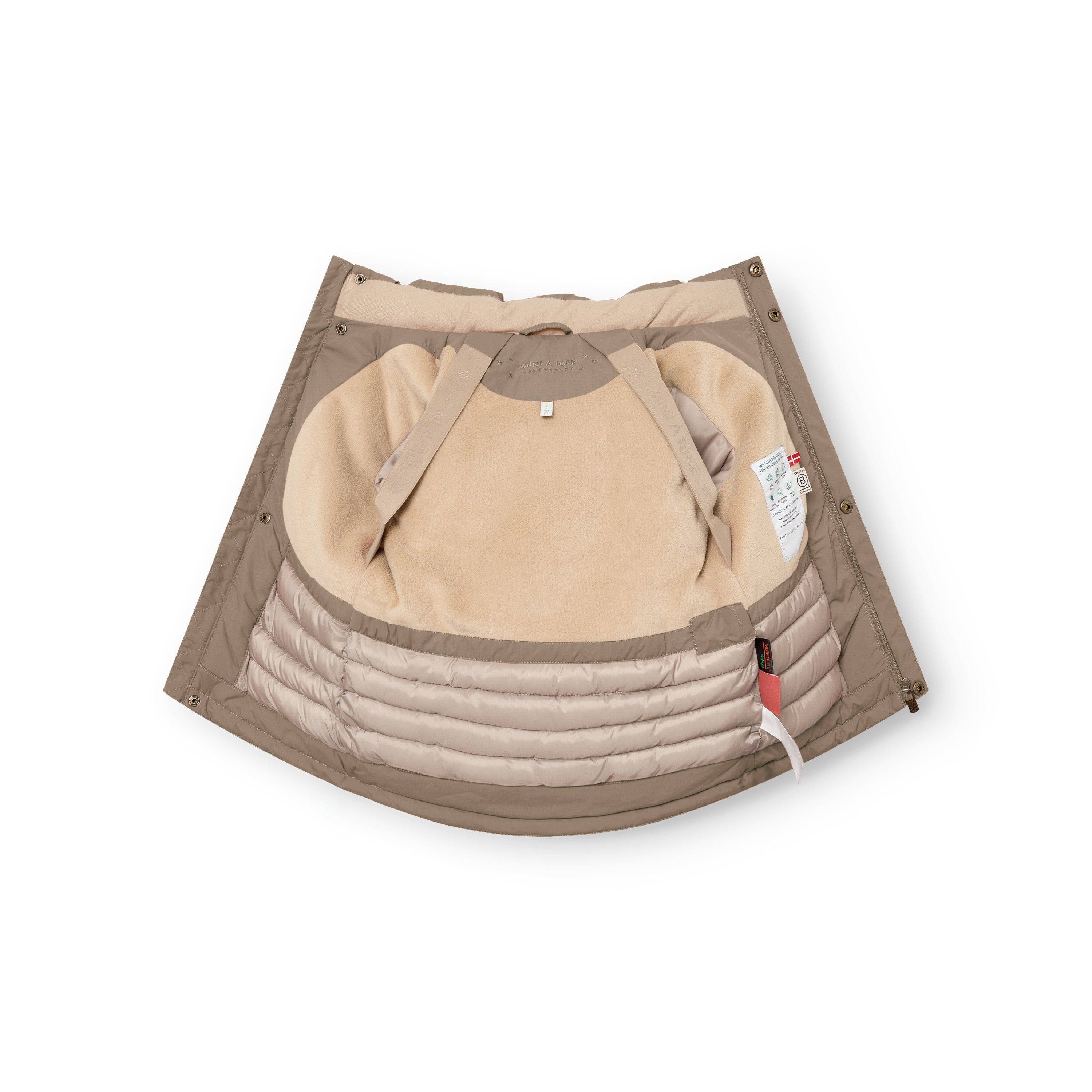 MATKASTORIO fleece lined winter jacket in beige, interior view showing the soft fleece lining at the upper body, Sorona Aura padded lower section, internal suspenders and care label, with the jacket folded open to display the construction.