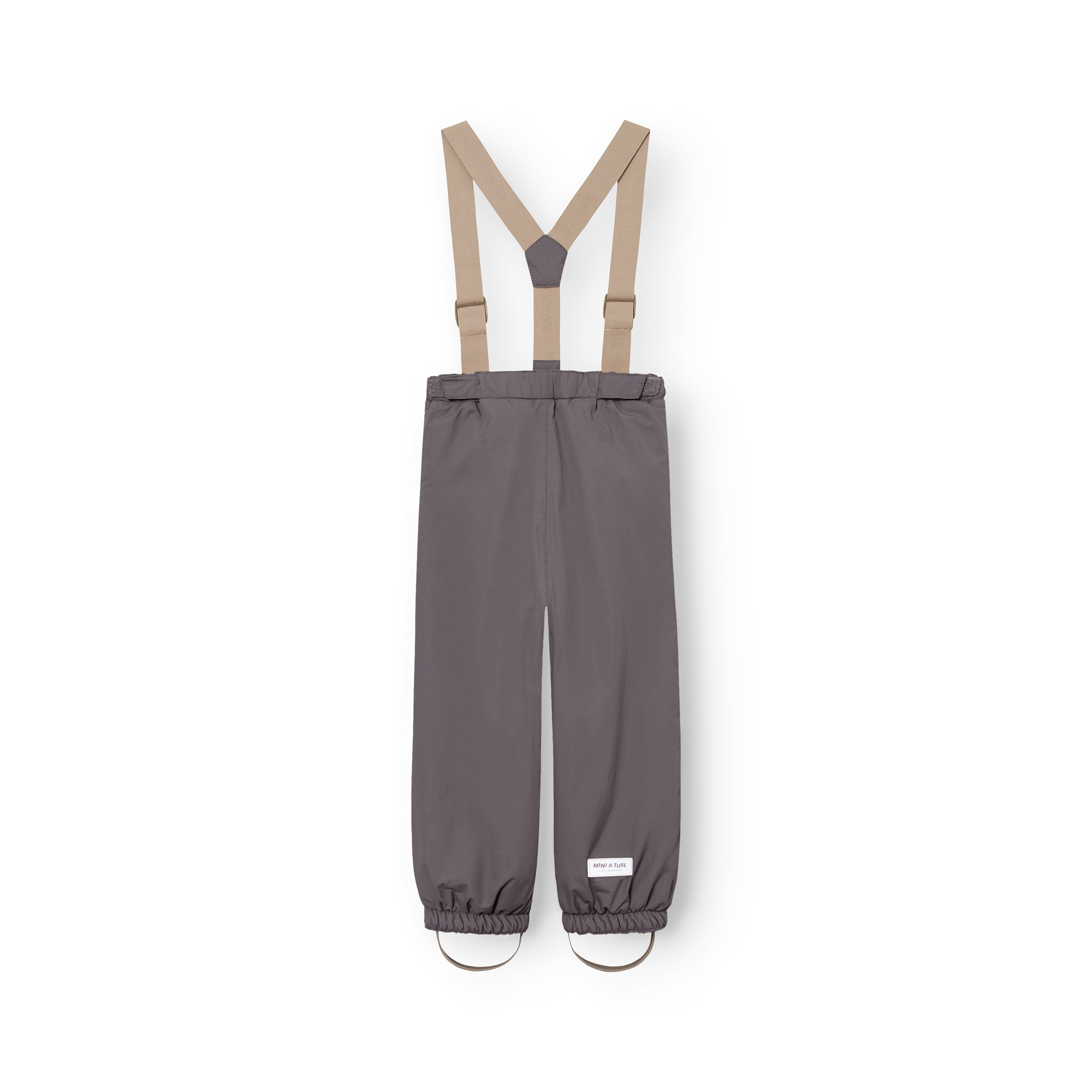 MATWILAS snow pants in charcoal grey with beige detachable cross-back braces, elasticated ankle cuffs and removable foot straps, photographed flat from the back on a white background.