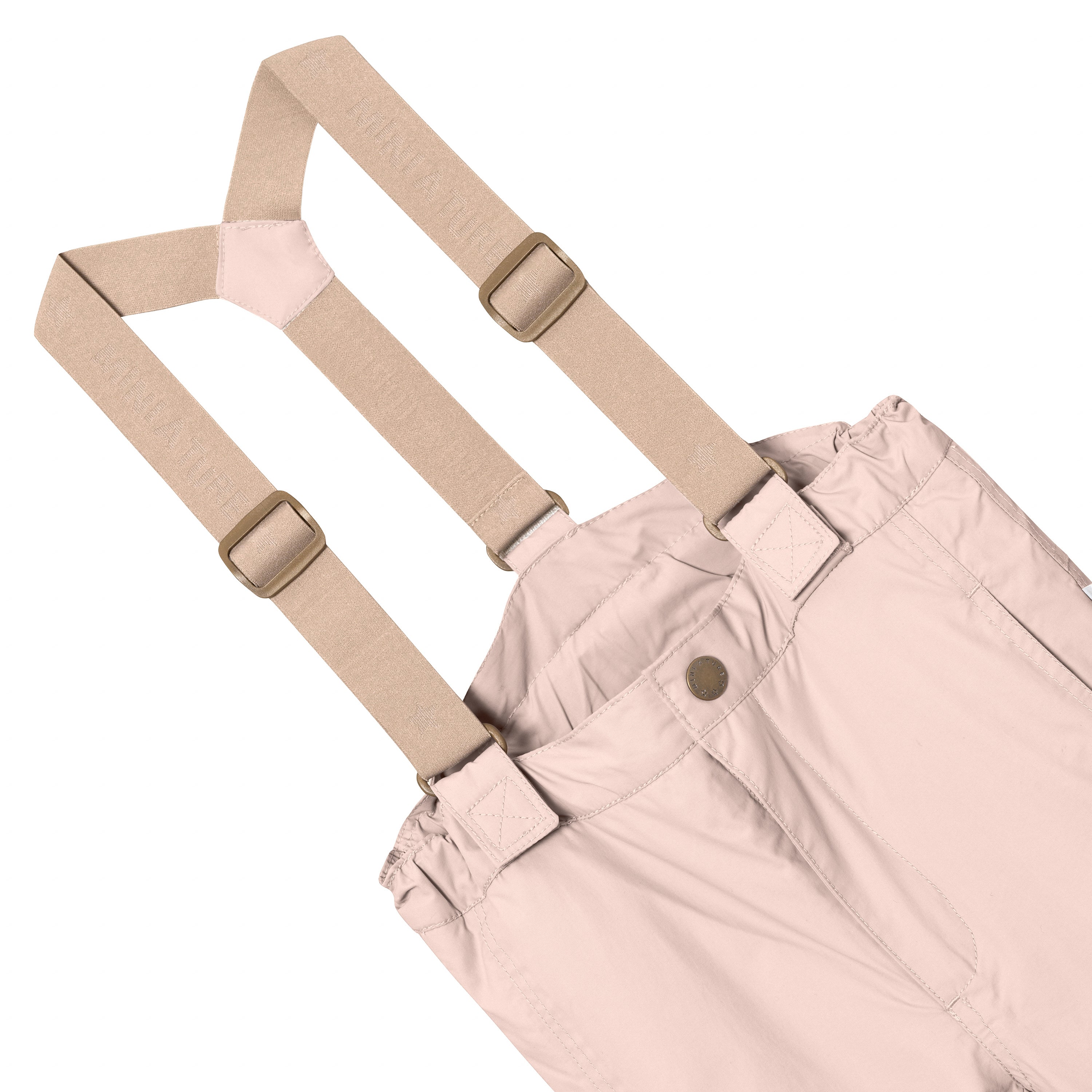 MATWITTE snow pants in soft pink showing the front waist detail with snap-button closure, elasticated waist and the removable beige elastic suspenders with metal slider adjusters attached to fabric loops at the front.