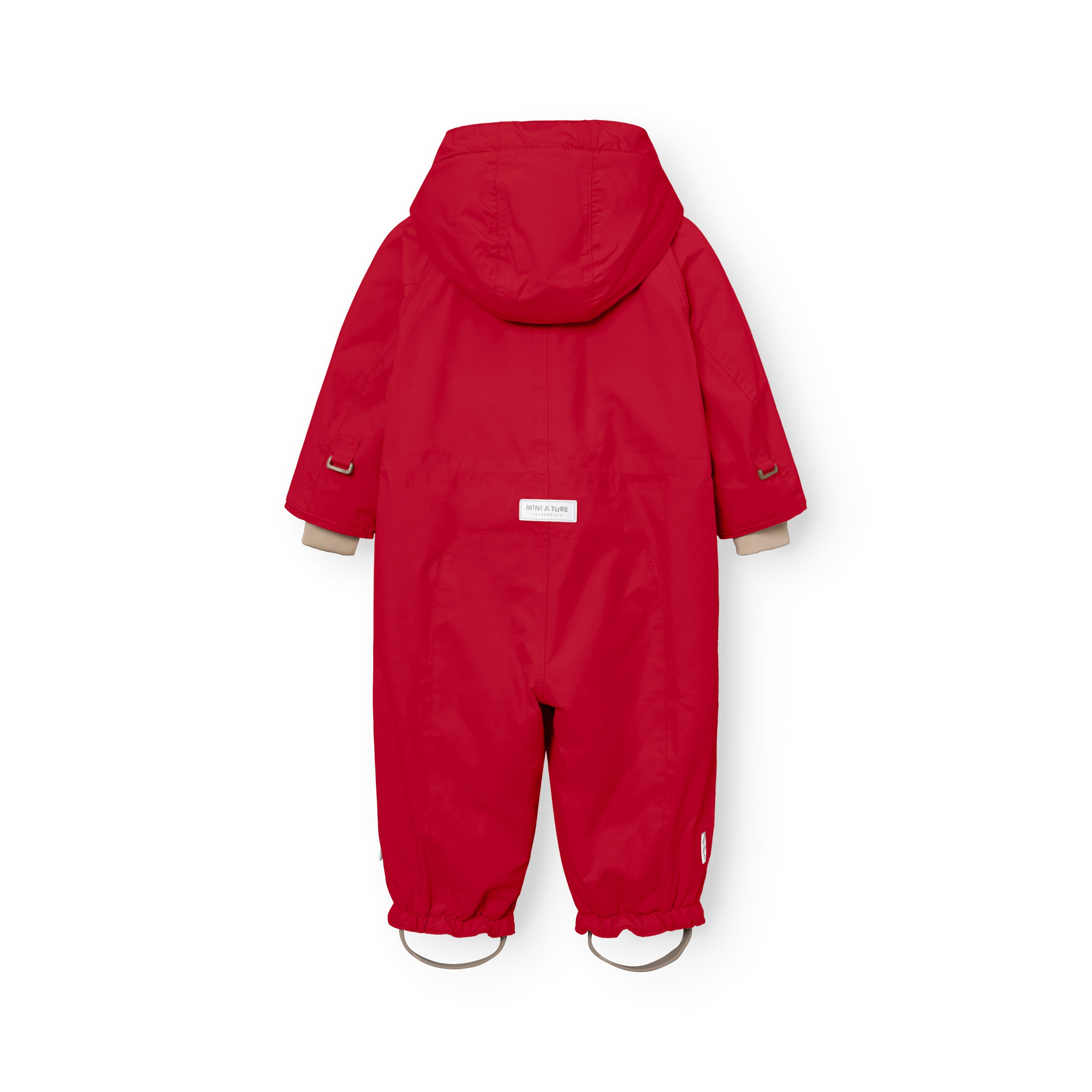 MATWISTI fleece lined snowsuit in bright red laid flat showing the rear view with detachable hood, white MINI A TURE label at the lower back, beige ribbed cuffs and elasticated leg openings with adjustable foot straps featuring metal D-rings.