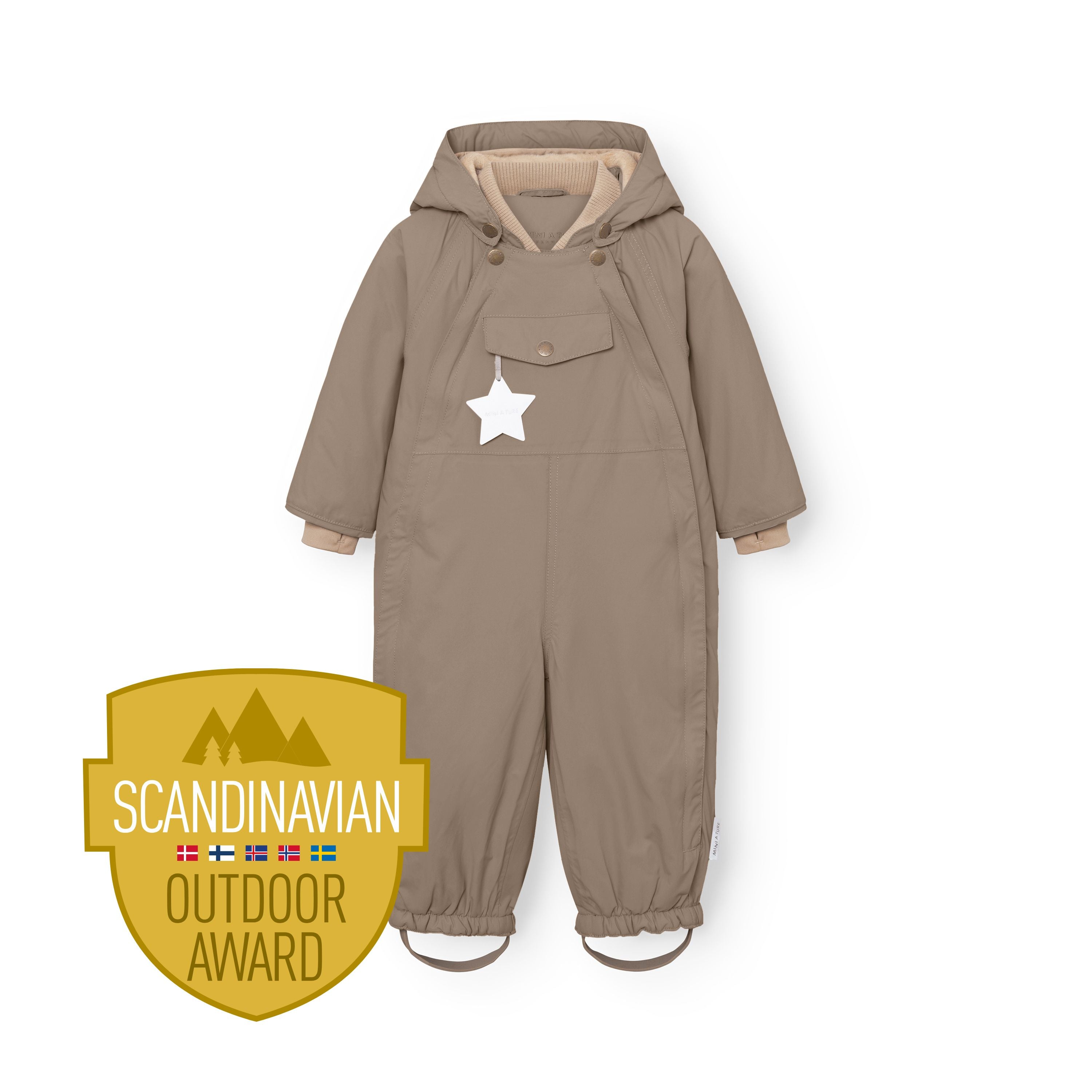 MATWISTI fleece lined snowsuit in warm beige displayed flat against a white background, showing the detachable hood with snap buttons, front chest pocket with white reflective star, beige ribbed cuffs at the wrists, elasticated leg openings with adjustable foot straps, and the Scandinavian Outdoor Award badge at the lower left.
