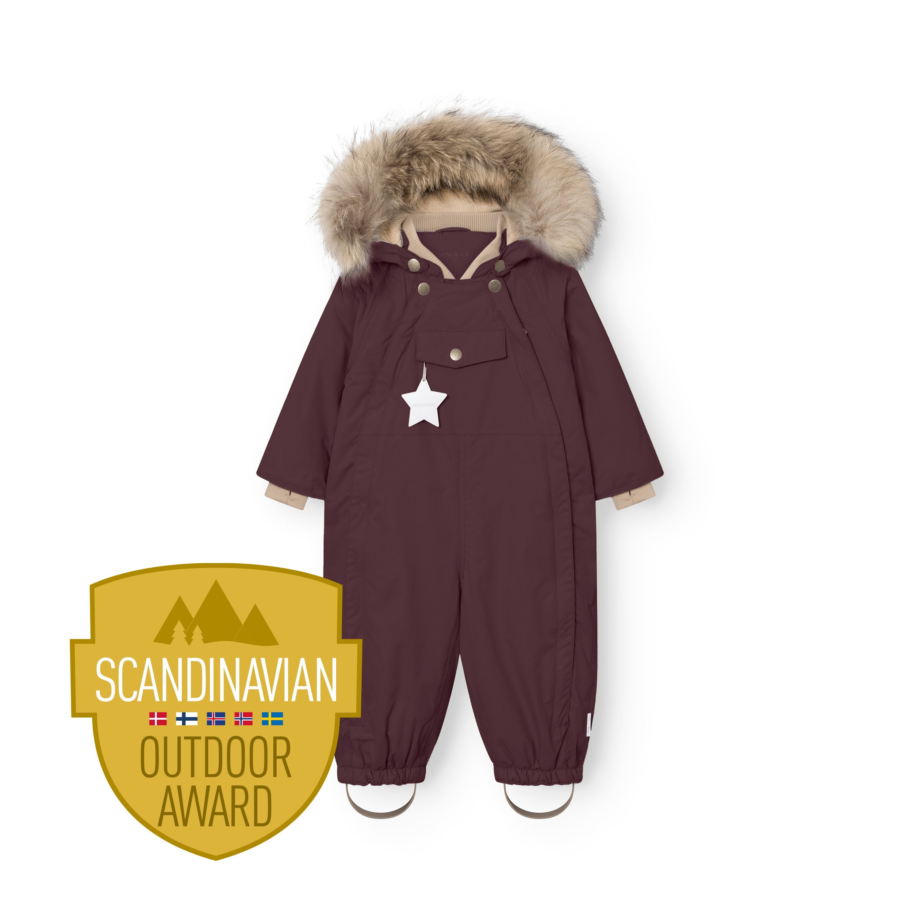 MATWISTI fleece lined snowsuit fur in deep burgundy with genuine fur-trimmed detachable hood, taupe ribbed collar, white reflective star on the front pocket, elasticated ankle cuffs with adjustable foot straps, and Scandinavian Outdoor Award badge.
