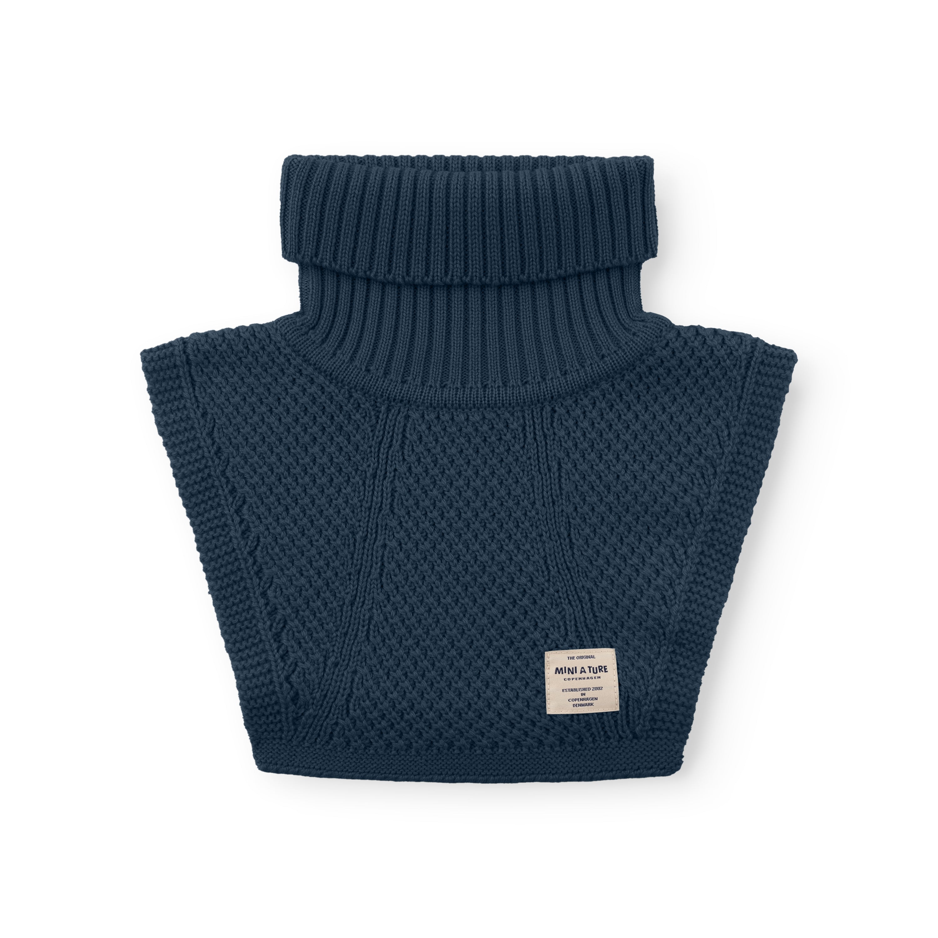 MATTAYLER neckwarmer laid flat on a white background, displaying the ribbed high neck and textured knit front and back panels in navy blue merino wool with a MINI A TURE label visible.