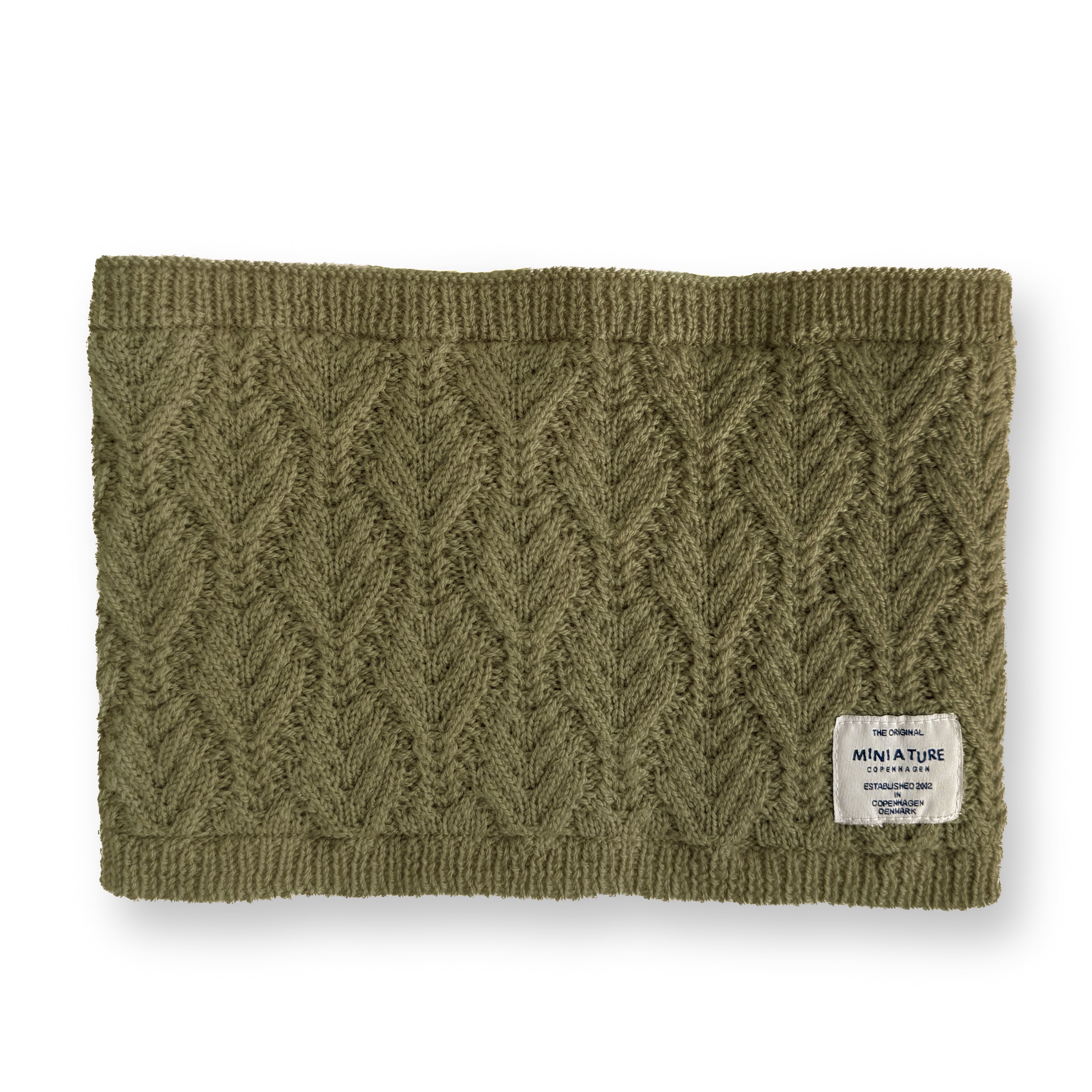 MATGOI fleece lined neckwarmer shown flat in olive green merino wool with a chevron knit texture, ribbed top and bottom edges, and a cream MINI A TURE woven label at the lower right.