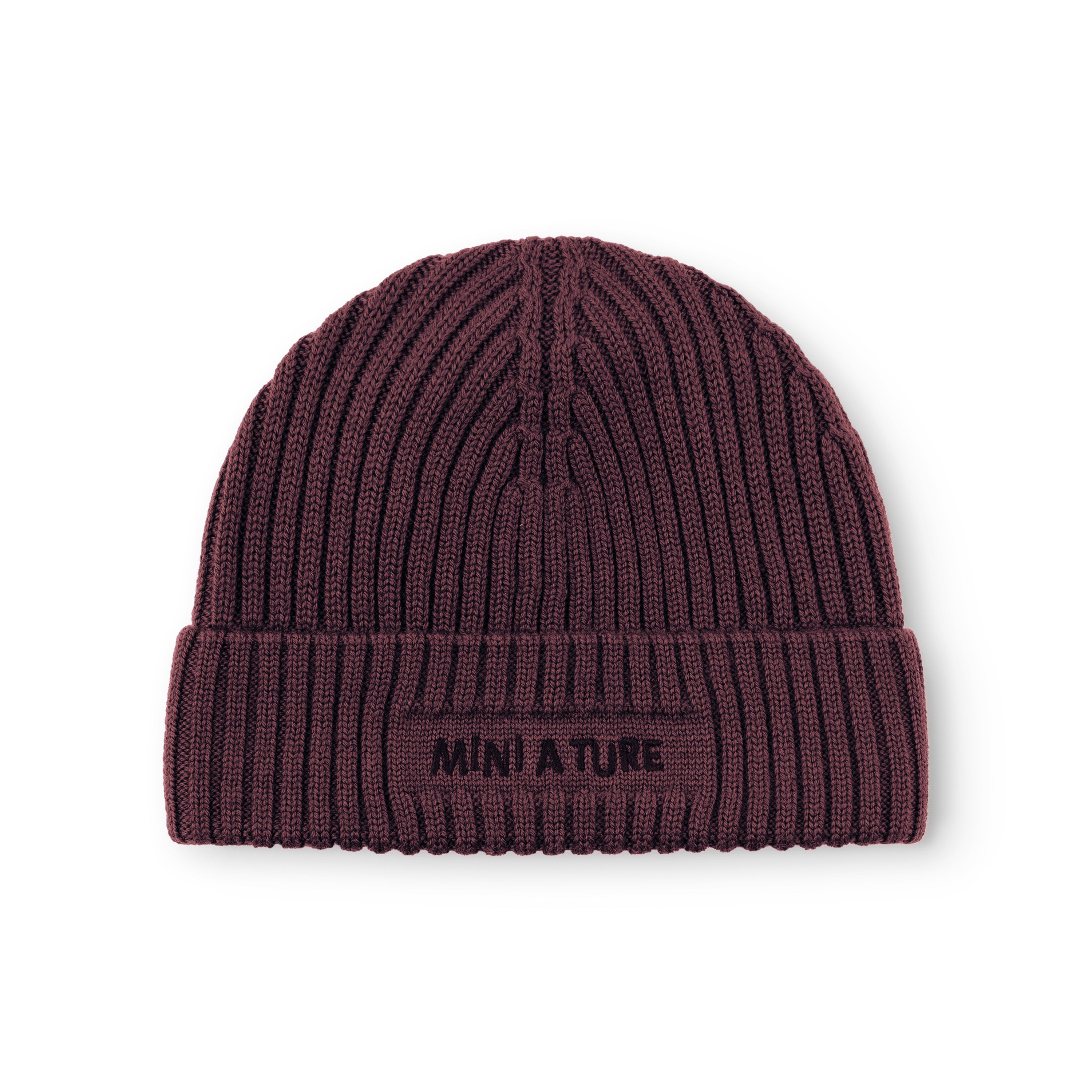 MATBOJE fleece lined beanie in deep burgundy merino wool with the fold-up brim in place, showing the embroidered MINI A TURE logo and the vertical ribbed knit pattern across the crown.