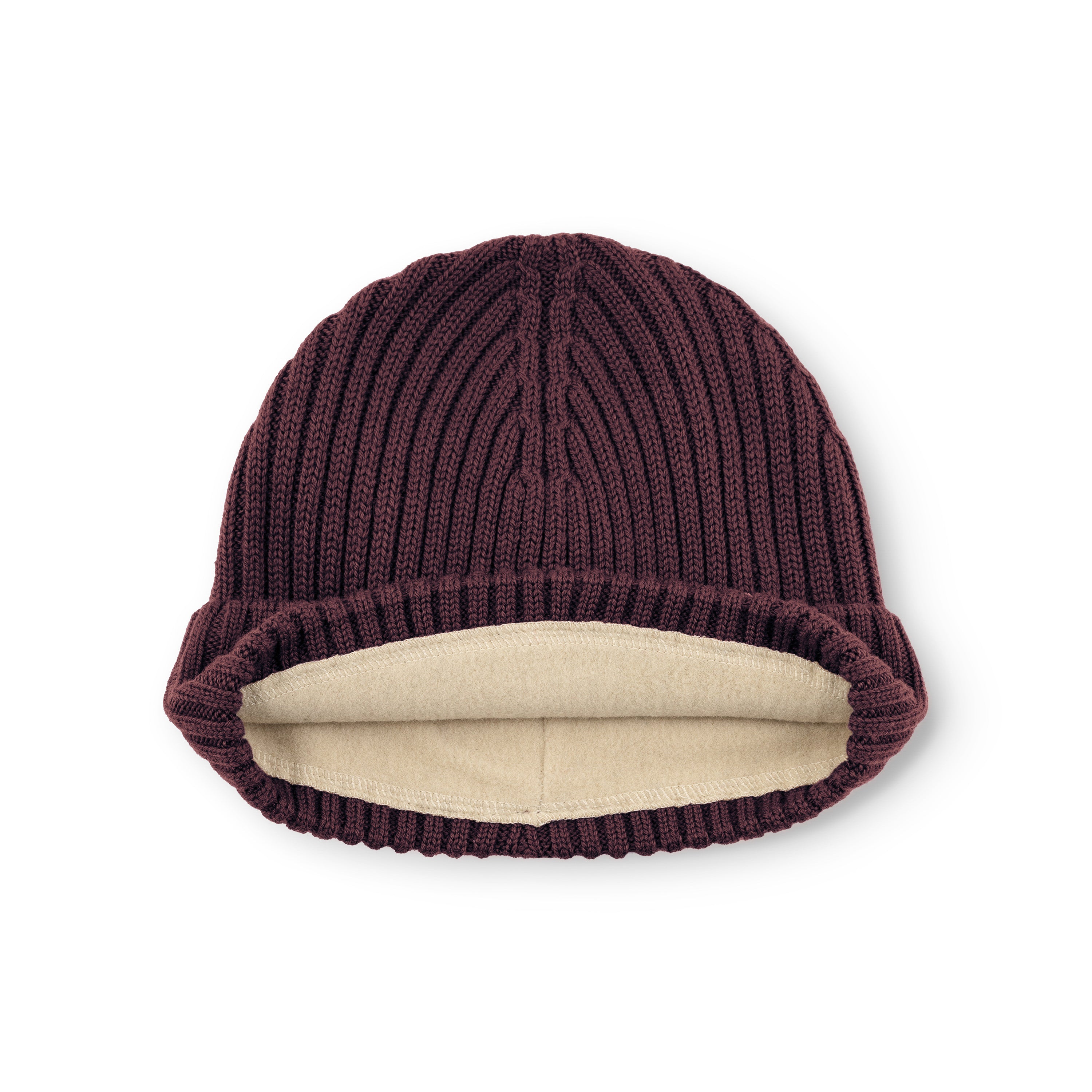 MATBOJE fleece lined beanie in deep burgundy merino wool laid flat with the fold-up brim turned back, revealing the cream fleece lining and the vertical ribbed knit texture across the crown.