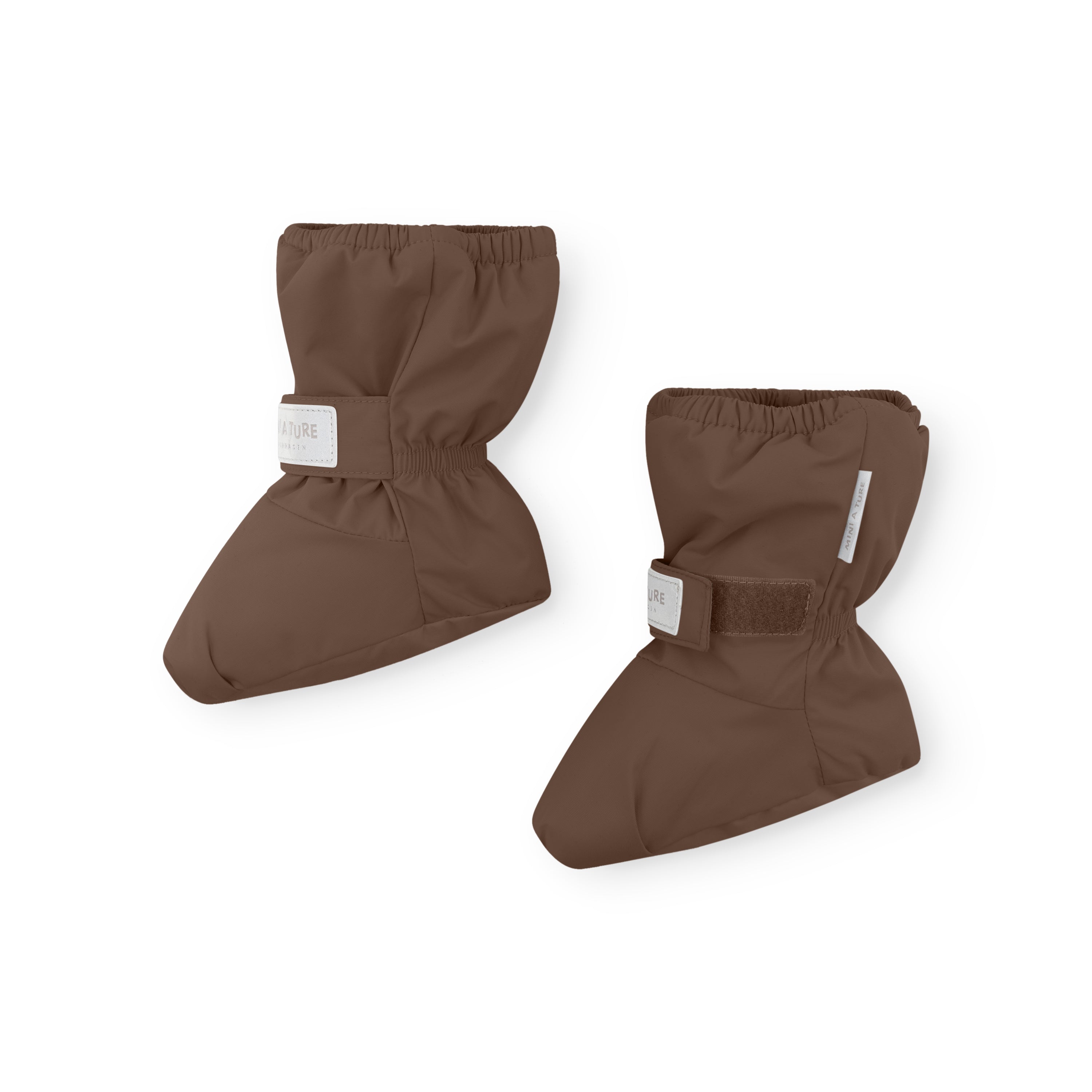 MATWINN waterproof baby outdoor socks in warm brown photographed as a pair at an angle, showing the velcro ankle strap with embossed MINI A TURE branding and the padded fleece-lined construction for insulated warmth during cold-weather pram outings.