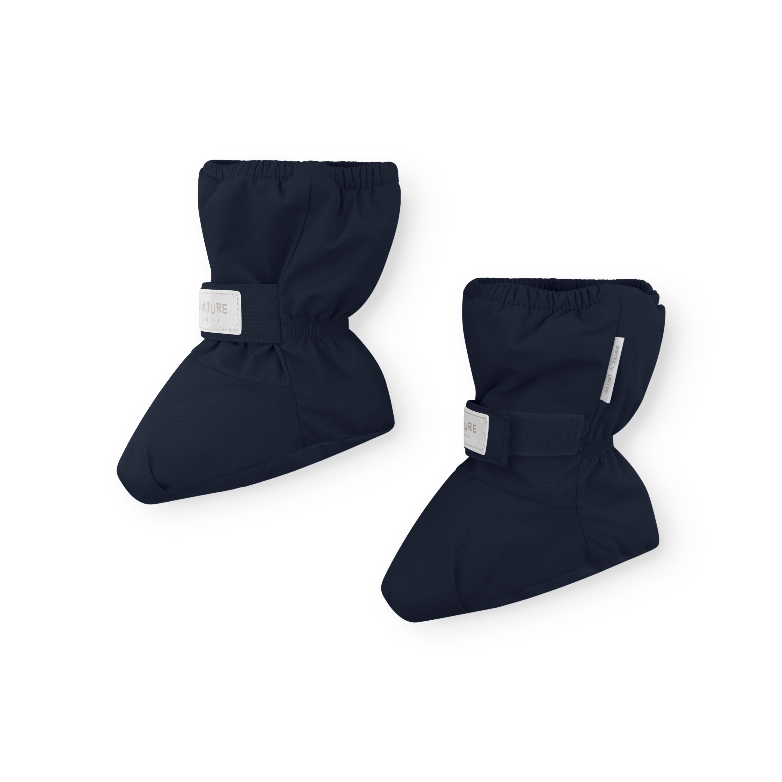 MATWINN waterproof baby outdoor socks in navy blue photographed as a pair from a side angle, showing the padded THERMOLITE construction, velcro ankle strap with reflective detail, and elasticated cuff for secure fit during cold-weather pram journeys.