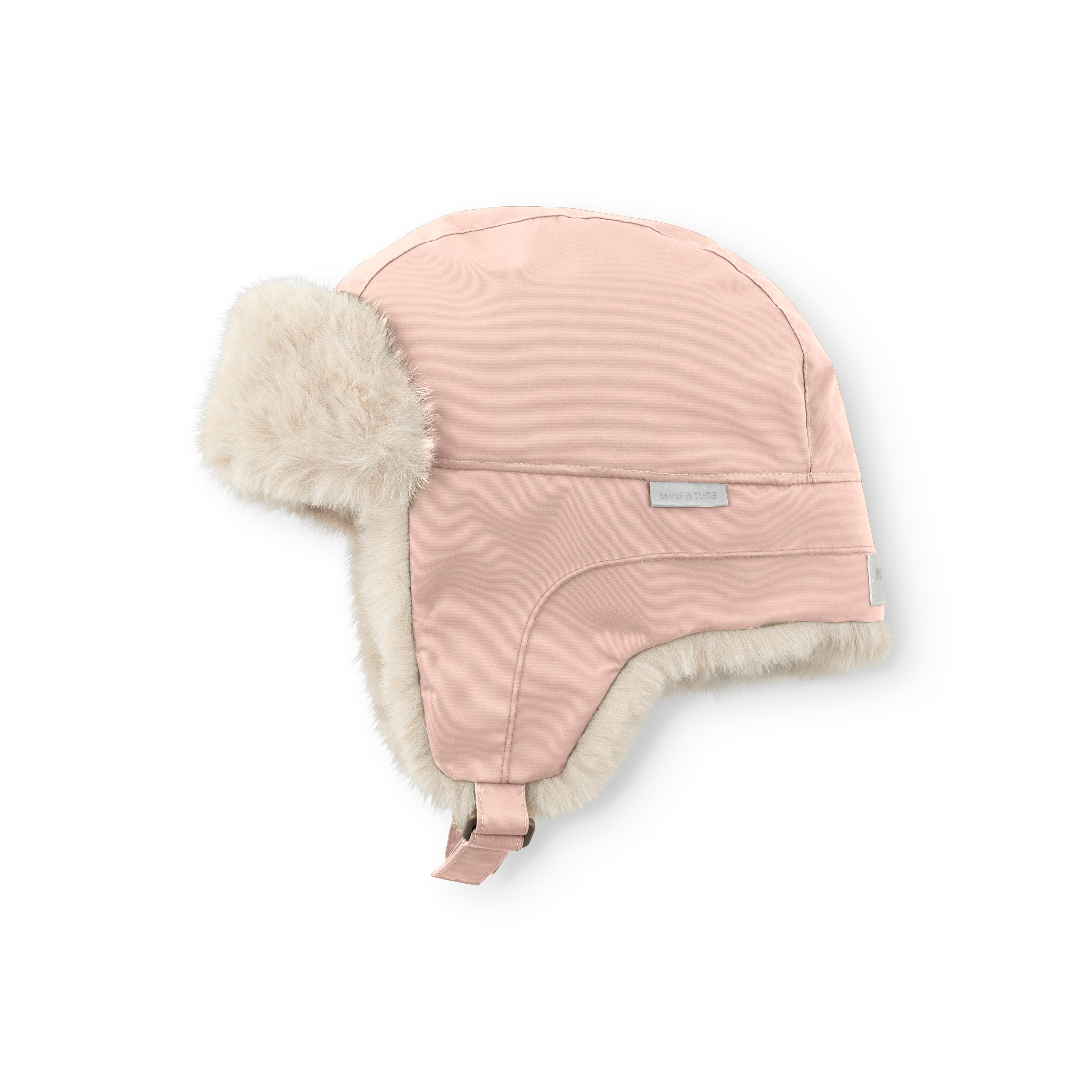MATCRISTER waterproof winter hood in blush pink with cream faux fur ear flaps and lining, shown from a side angle with the velcro chin strap visible and MINI A TURE label on the crown.