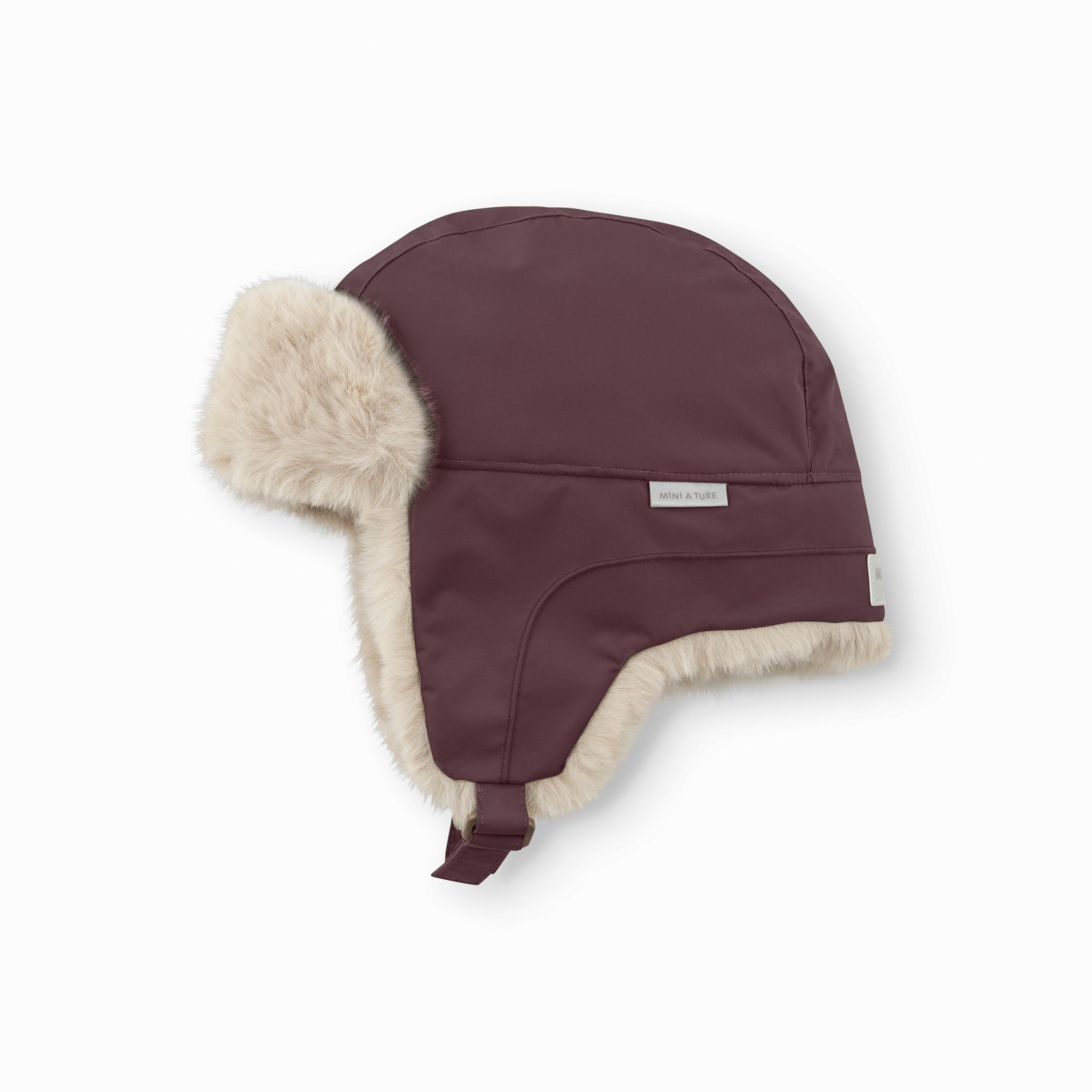 MATCRISTER children's trapper hat in deep burgundy with cream fleece lining, featuring a waterproof recycled nylon shell, adjustable ear flaps and MINI A TURE branded label.