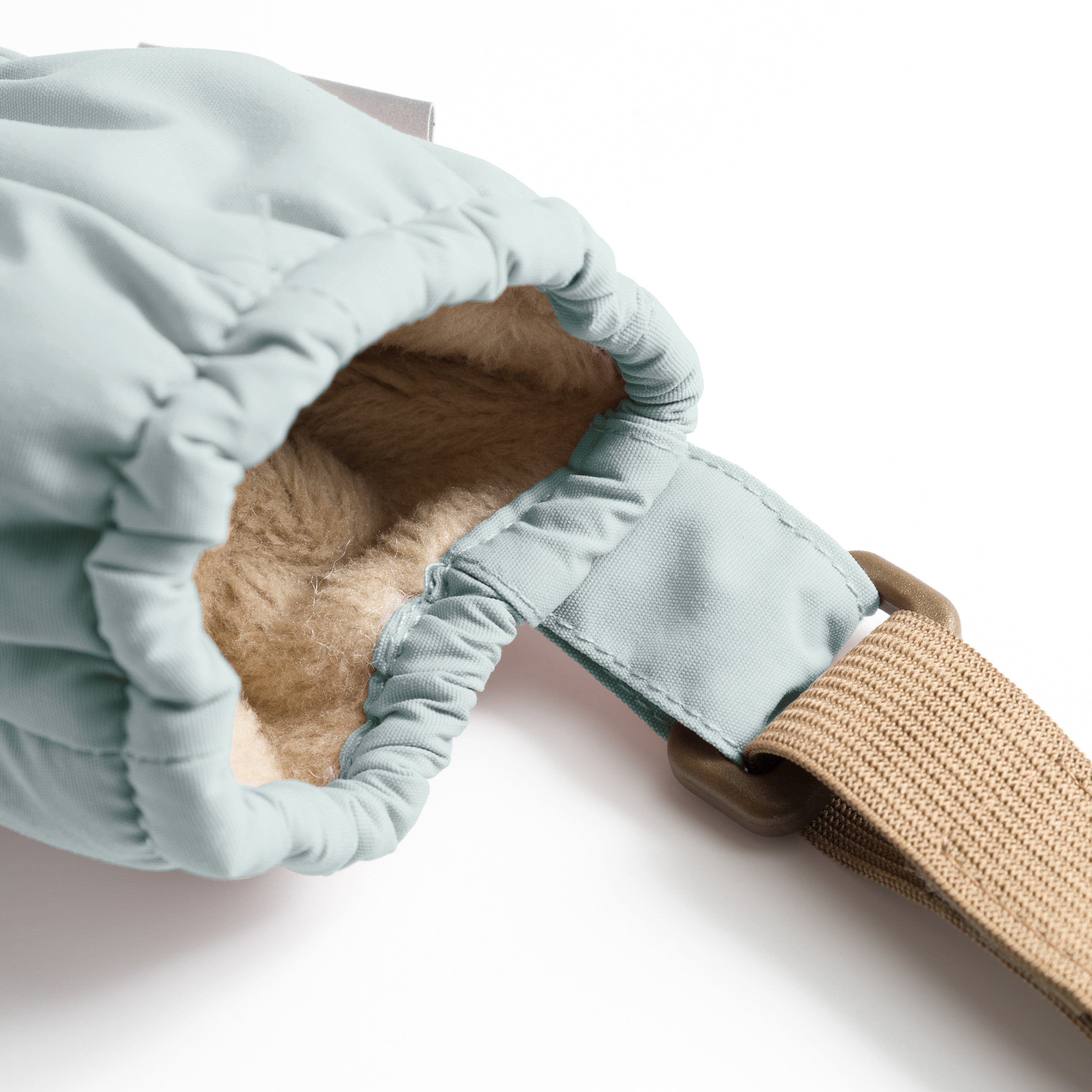MATCORDT fleece lined mittens in pale blue shown from the interior with the cuff turned back, revealing the soft beige fleece lining that sits comfortably against skin and the elastic gathered construction at the wrist that seals out cold air and moisture.