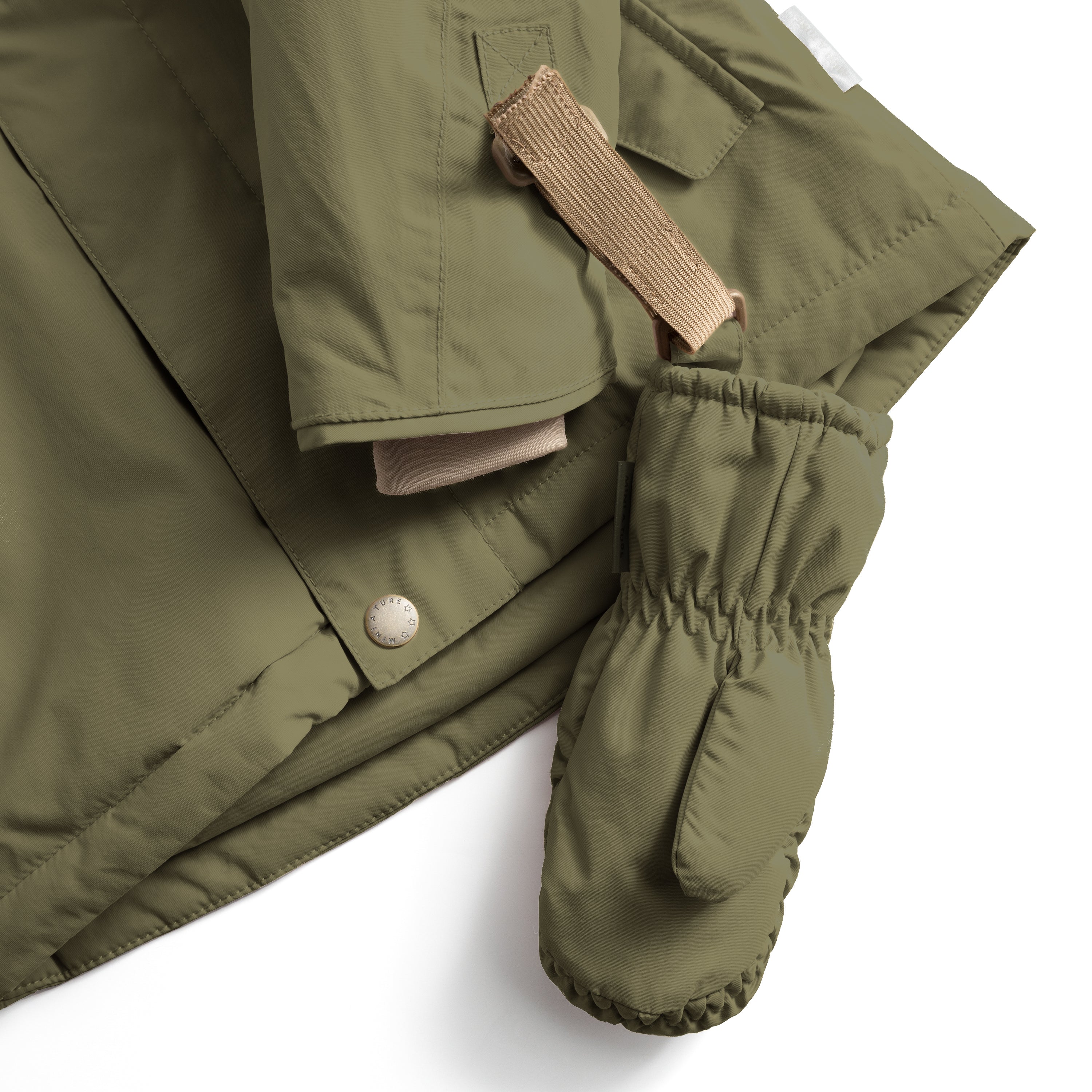 MATCORDT fleece lined mittens in olive green shown in detail, highlighting the beige velcro strap threaded through a D-loop attachment point, the elastic gathered cuff and the waterproof recycled polyamide shell designed to withstand repeated outdoor wear.