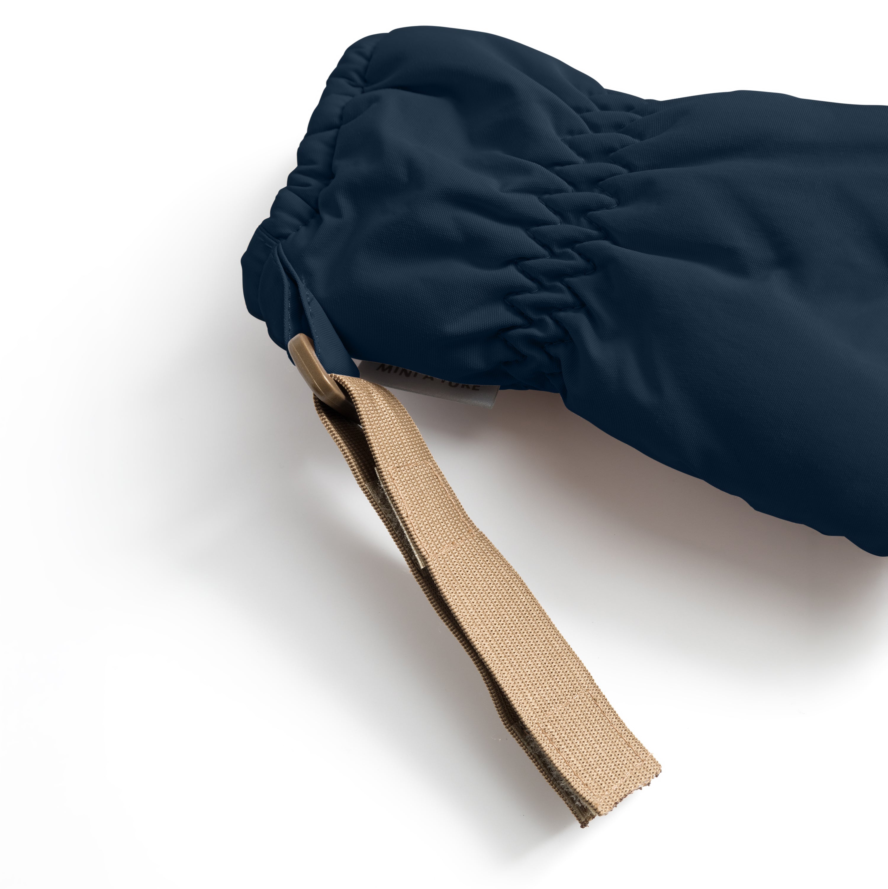 MATCORDT fleece lined mittens in navy blue shown from the interior with the cuff folded back, revealing the soft beige fleece lining, THINSULATE padding and the elastic gathered wrist construction that seals out draughts, alongside the extended beige velcro attachment strap.