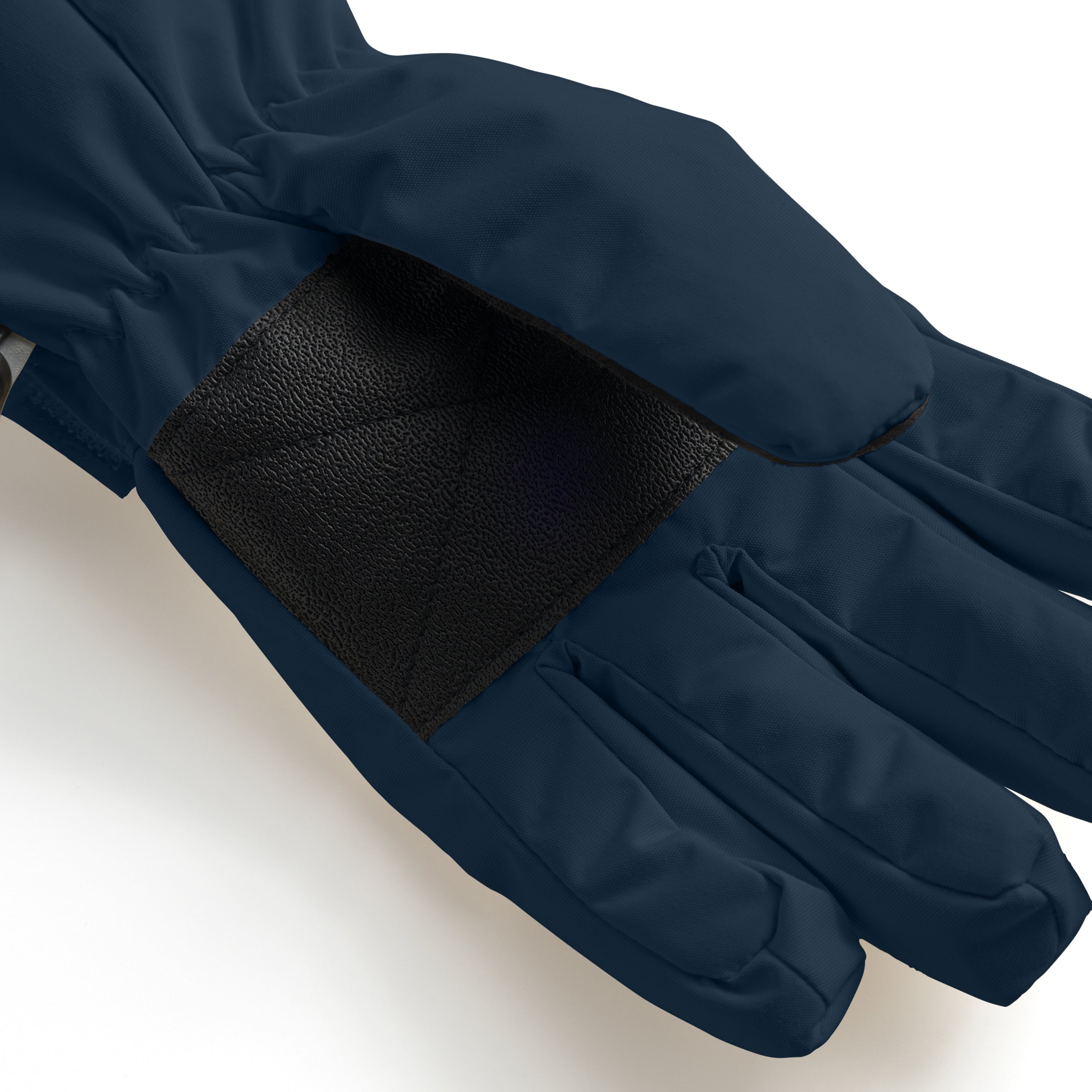 MATCELIO gloves in deep navy blue photographed in close-up to show the black elasticated wrist cuff positioned inside the extended navy cuff, demonstrating the dual-layer construction that seals out cold air and snow during winter wear.
