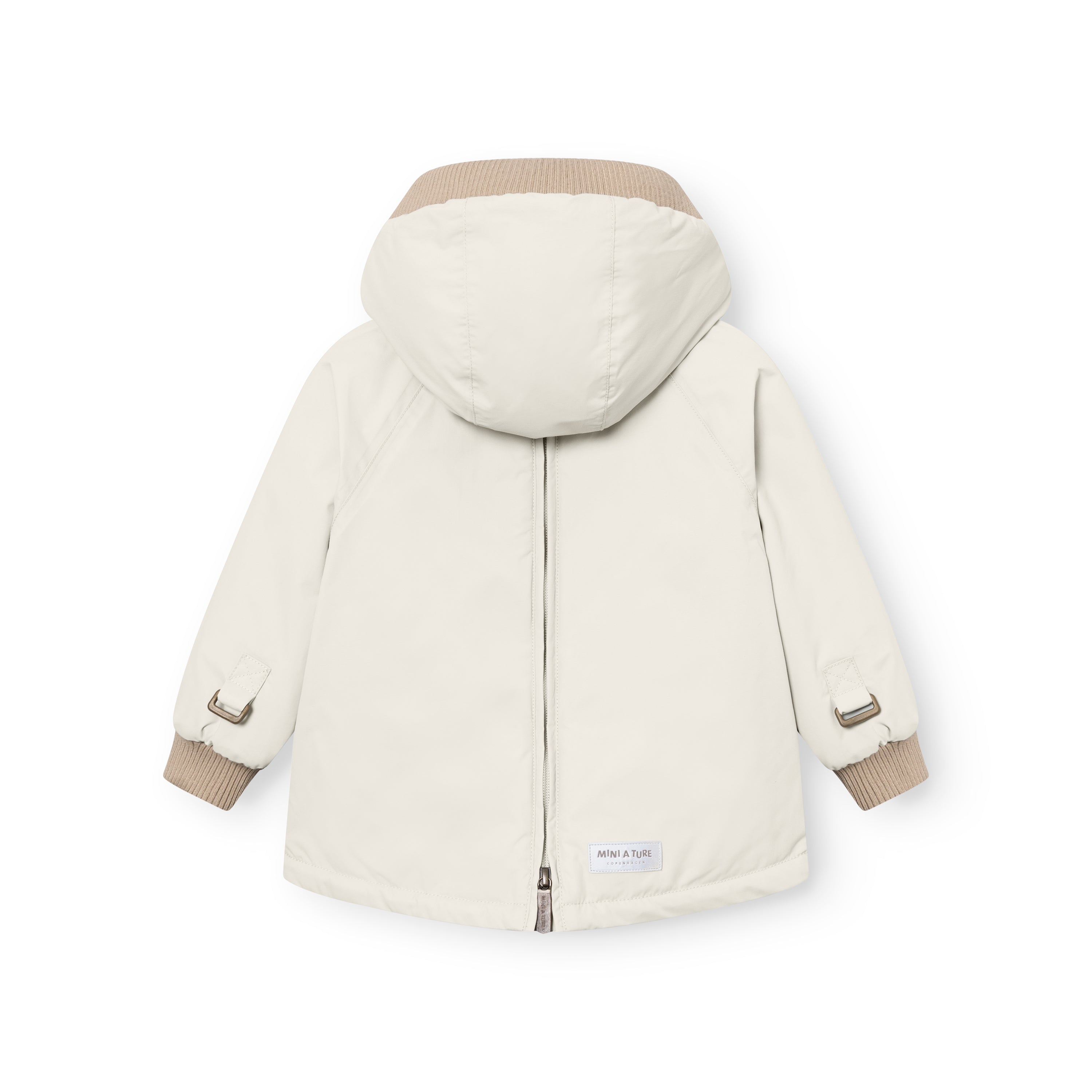 MATBABYWEN anorak in cream laid flat to show the full-length back zip running from hem through the hood, with beige ribbed collar and cuffs, and a MINI A TURE label at the lower back.