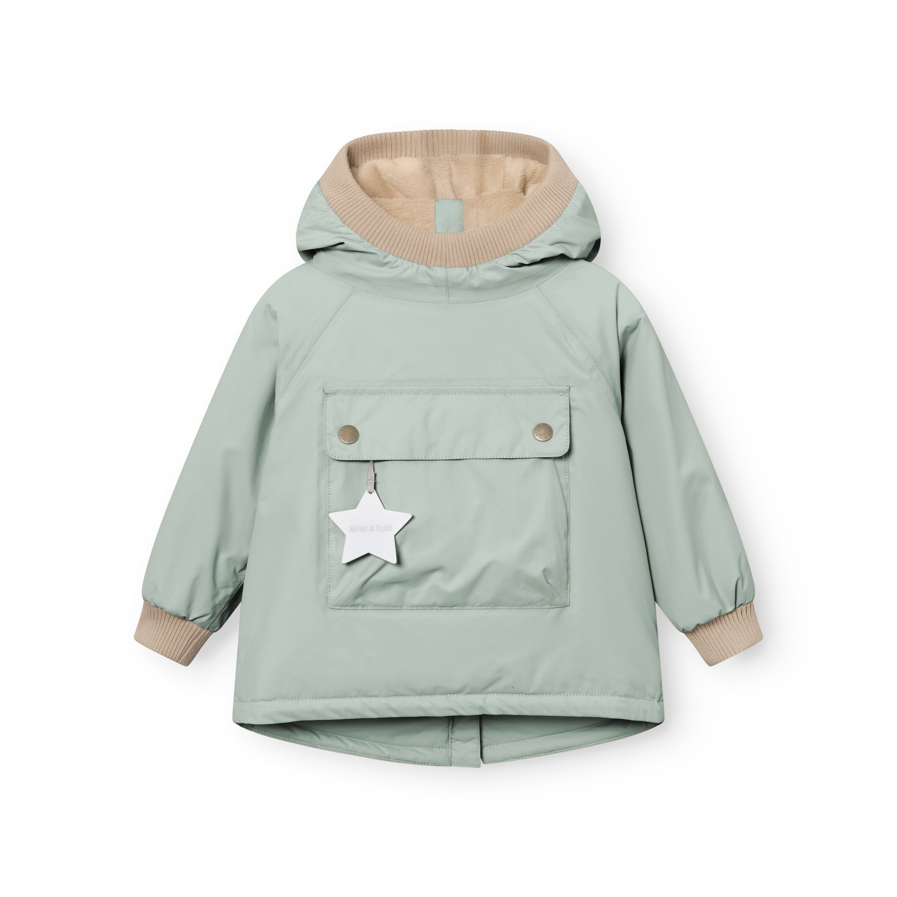 MATBABYWEN anorak in pale green shown from the front, featuring a snap-button pocket with a white reflective star tag, beige ribbed hood and cuffs, raglan sleeves, and an A-line hem with a small back vent.