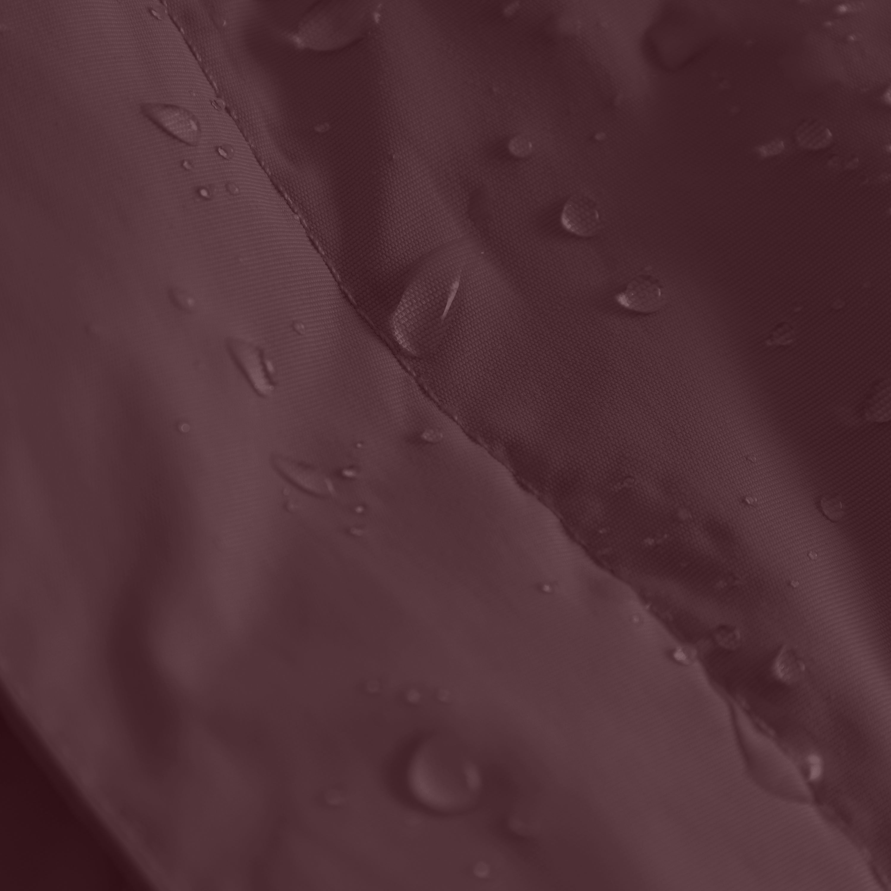 Close-up of the MATWANG fleece-lined winter jacket's snow cuff at the wrist, showing the beige ribbed knit inner cuff with thumb opening extending from the deep burgundy waterproof recycled nylon sleeve, with water droplets visible on the outer shell demonstrating the fluorine-free water-repellent treatment.