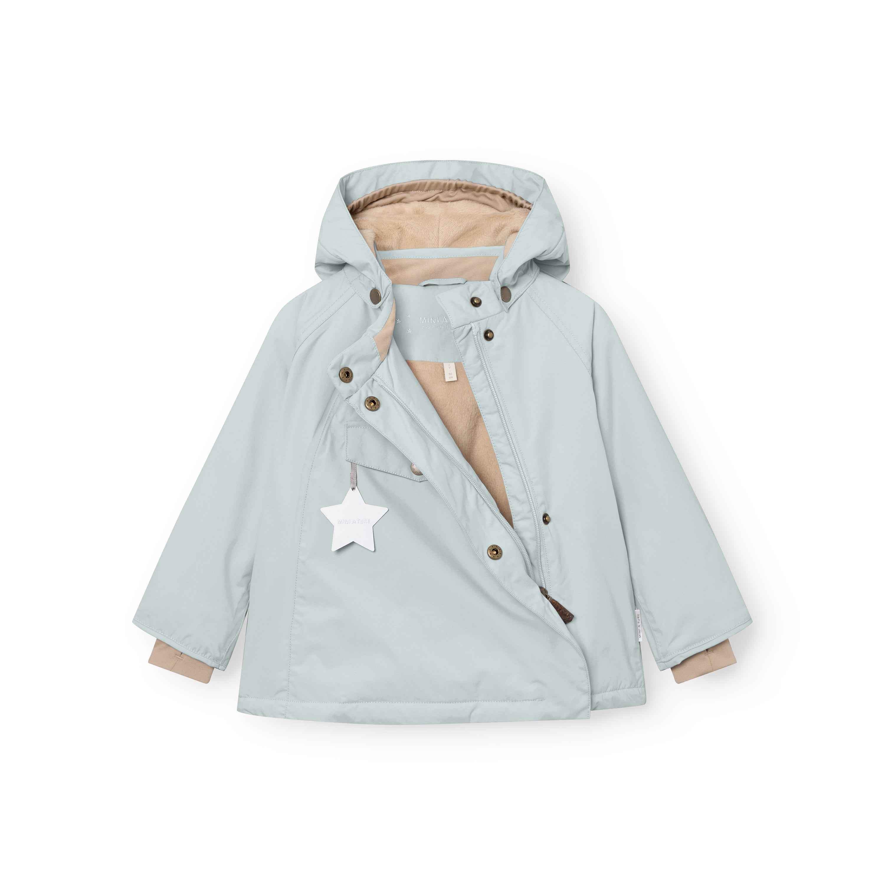 MATWANG fleece-lined winter jacket in pale blue laid flat showing the hidden slanted front zip partially open to reveal the beige fleece lining, detachable pointed hood with bronze-toned press studs, white reflective star hanging from the chest pocket, and bronze metal hook fastenings visible at the cuffs.