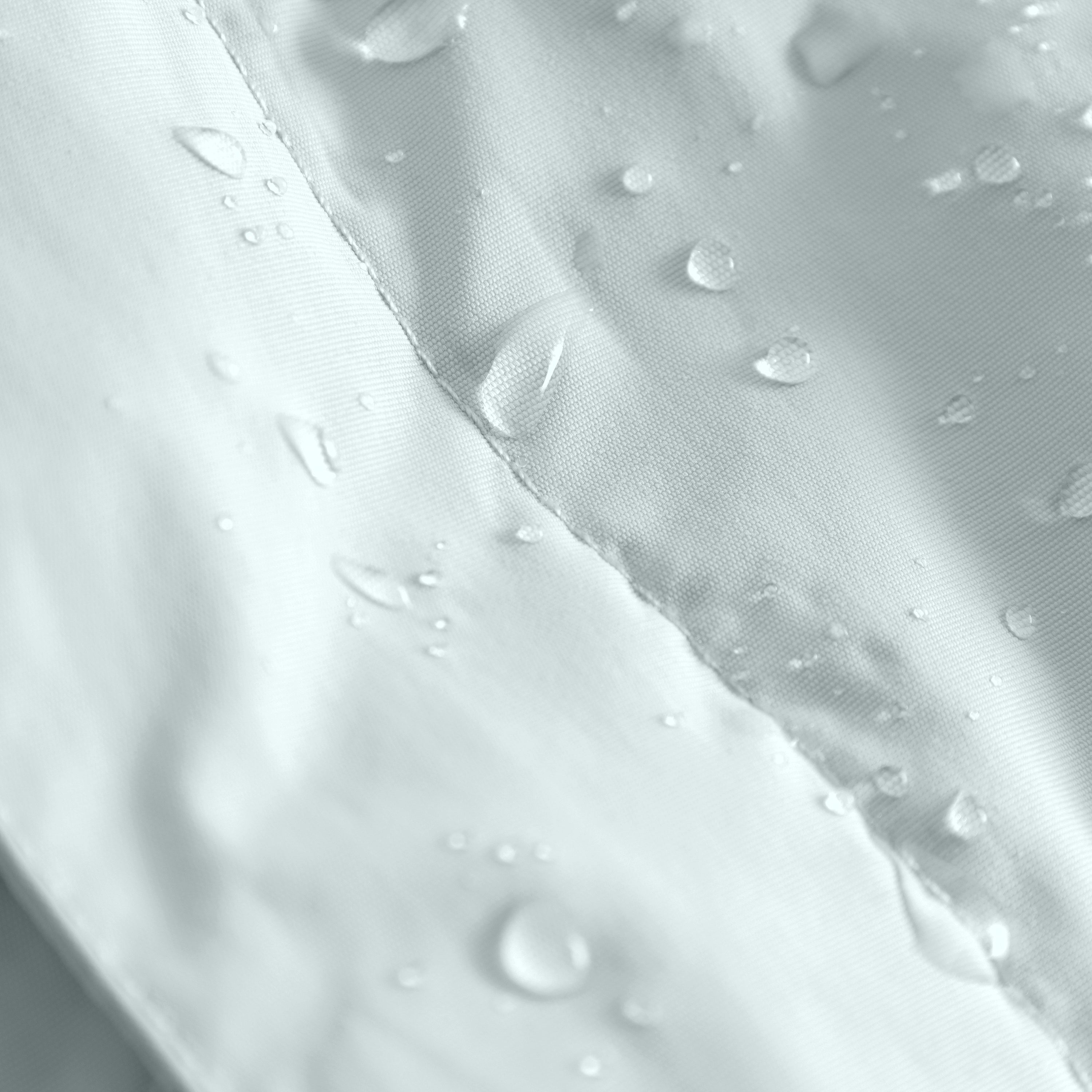 Close-up of water droplets beading on the pale blue waterproof recycled nylon shell of the MATWANG fleece-lined winter jacket, demonstrating the fluorine-free Bionic Finish Eco treatment's water-repellent performance across the fabric surface and fully taped seam construction.