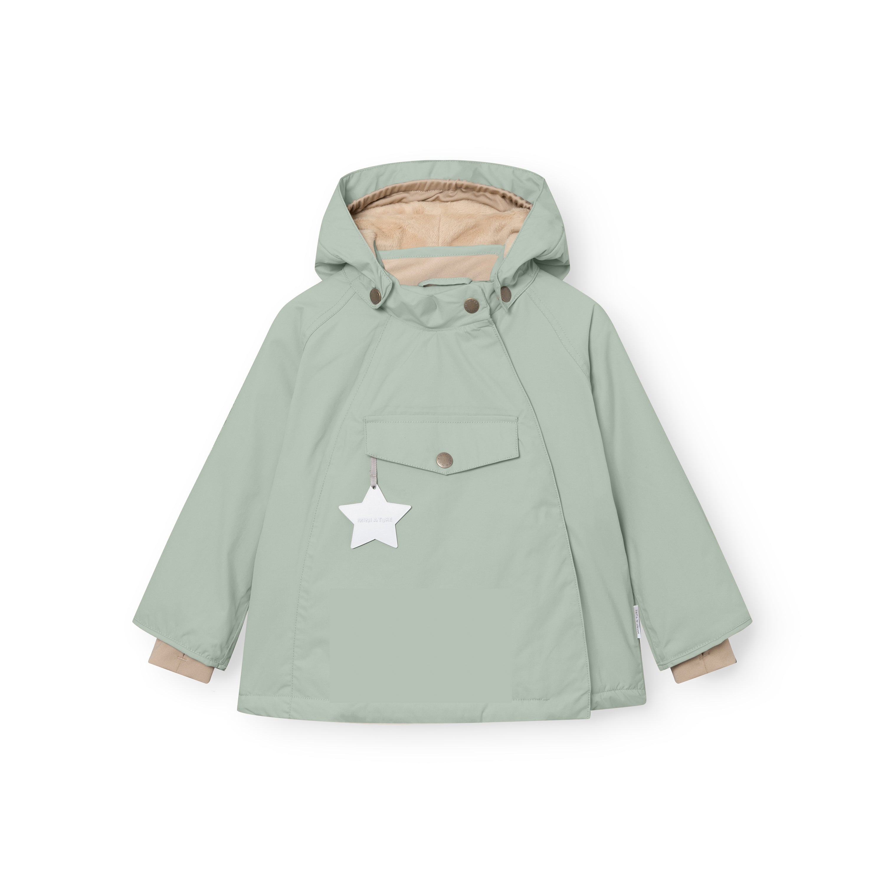 MATWANG fleece-lined winter jacket in soft sage green showing the front view with the detachable pointed hood, bronze press-stud fastenings, concealed slanted zip, chest pocket with bronze snap closure, white reflective star hanging from the pocket, and beige fleece lining visible at the cuffs and hood opening.