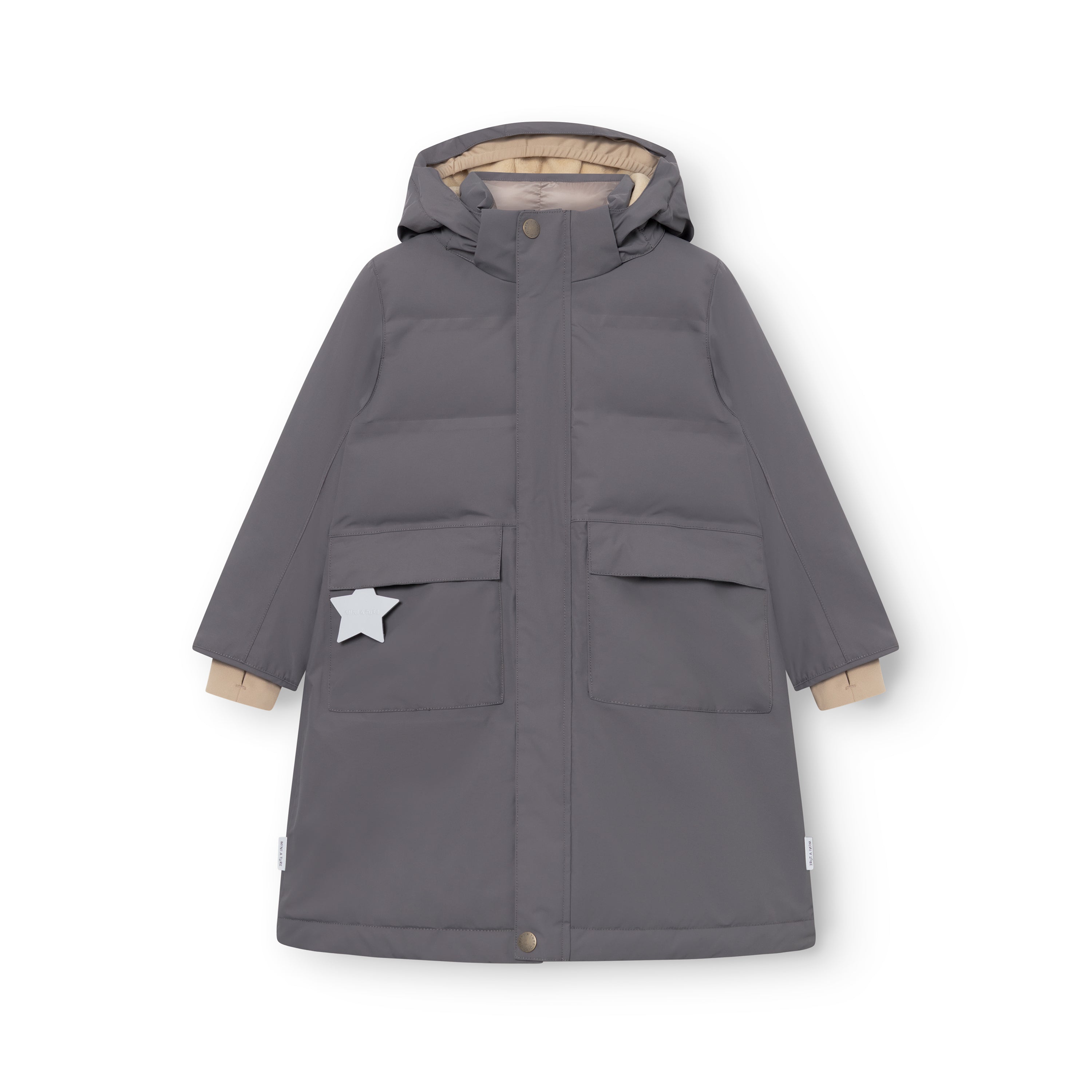 MATVENCASIA winter jacket in charcoal grey, laid flat to show the extended length, detachable hood with snap-button fastening, front patch pockets with magnetic closures, white reflective star detail on the left pocket, and beige cuff lining visible at the wrists.