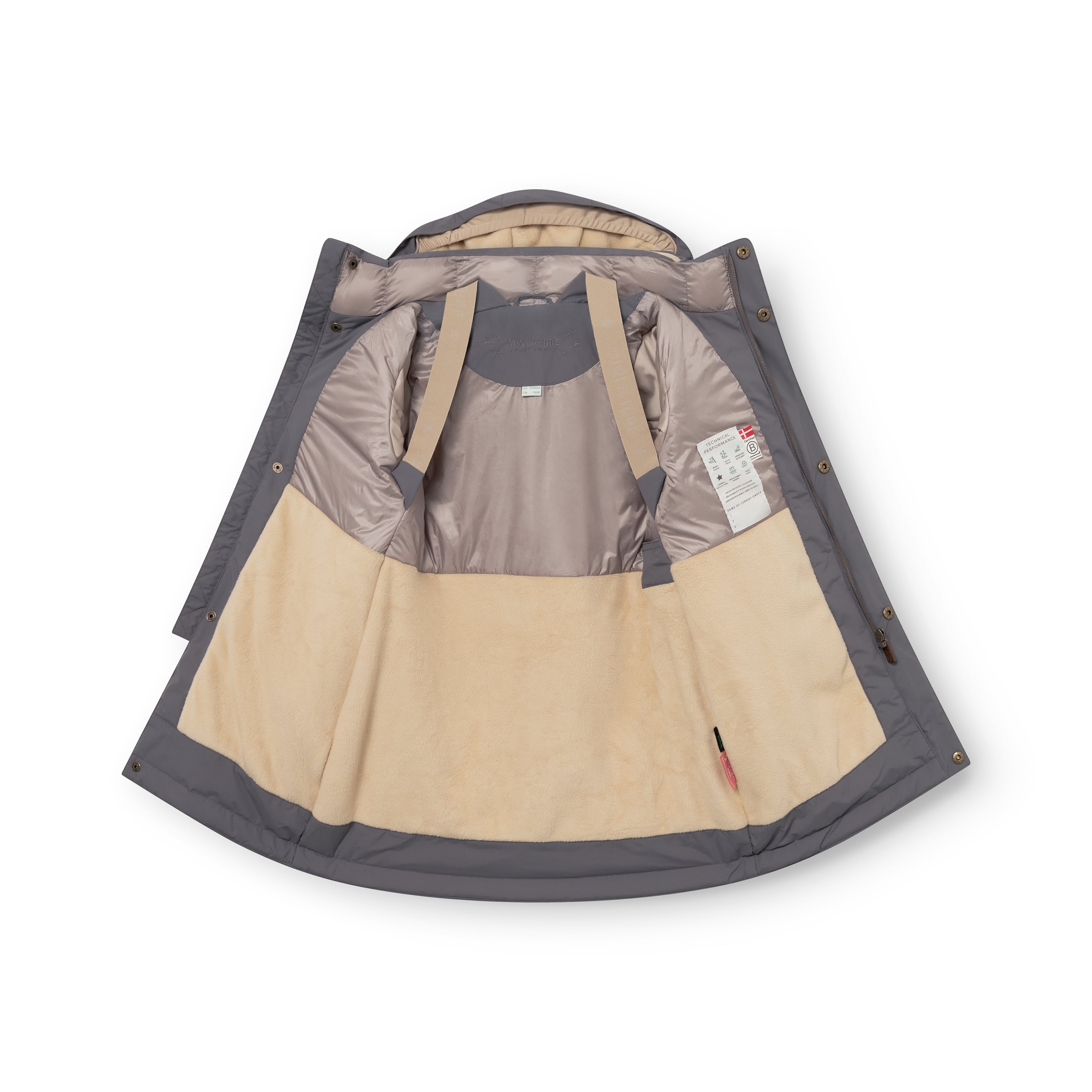 MATVENCASIA winter jacket in charcoal grey, photographed open and laid flat to reveal the beige internal suspenders, pale grey Sorona Aura padded upper lining, cream fleece lower lining, snap-button hood attachment points, and care label visible inside the right panel.