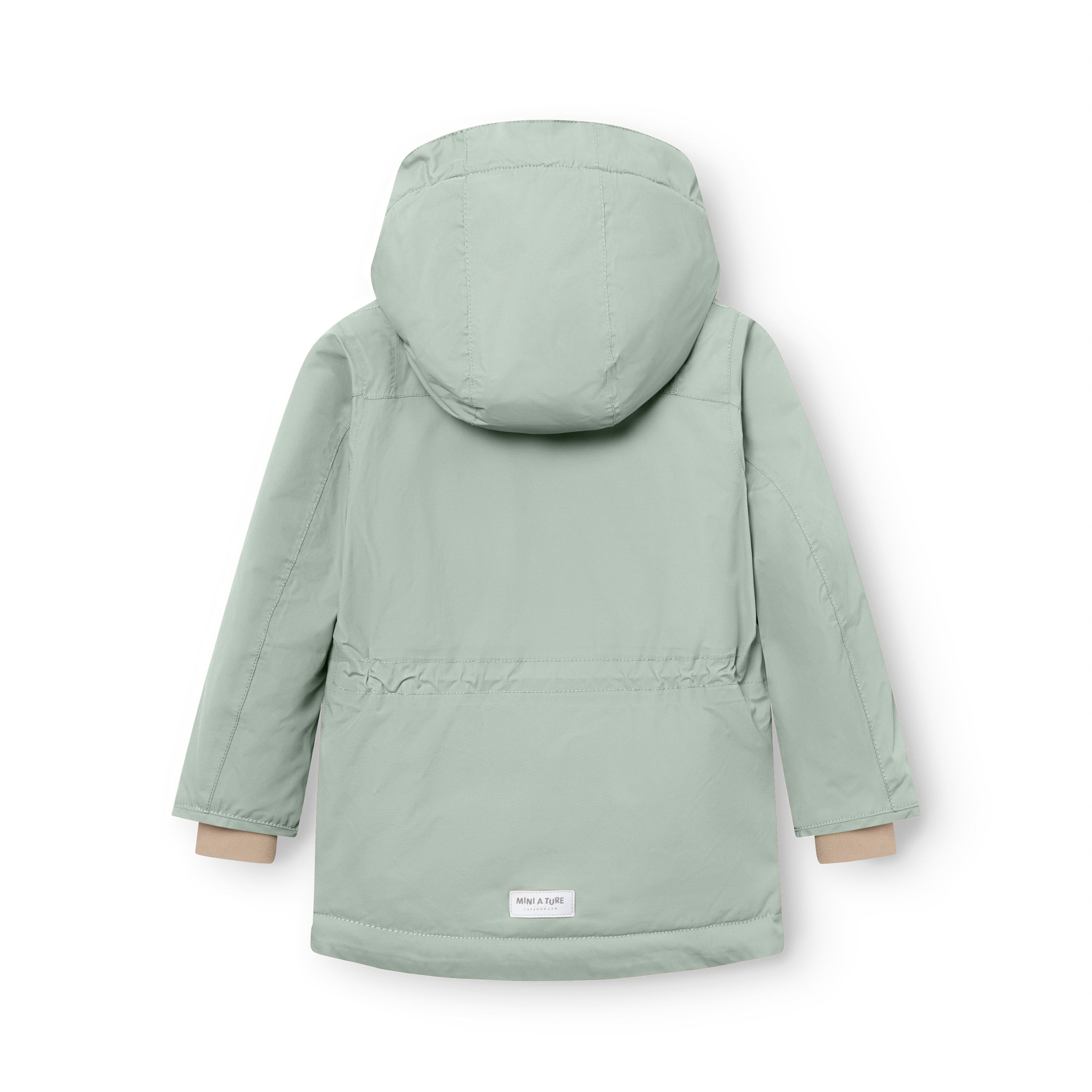 Sage green MATKASTORIO fleece lined winter jacket viewed from the rear, showing the detachable hood, extended parka-length hem, horizontal seam dividing the fleece-lined upper section from the Sorona Aura padded lower section, and white MINI A TURE woven label at the lower back hem.