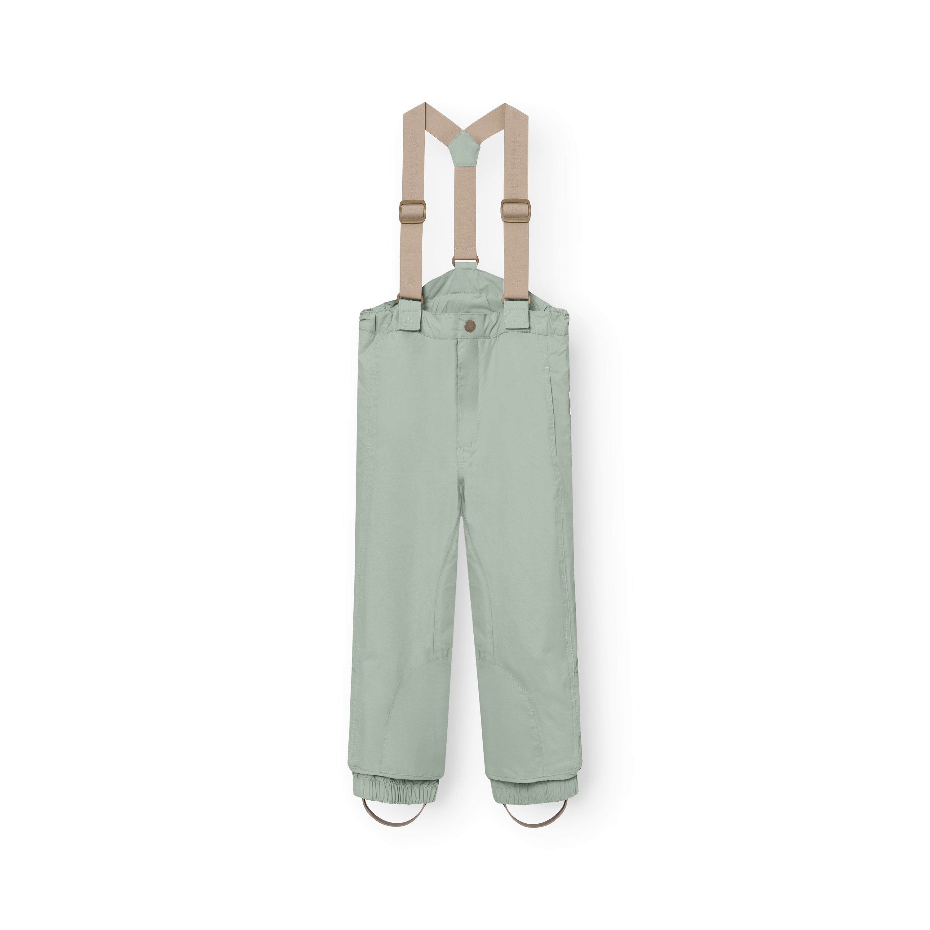 MATWITTE snow pants in pale green with removable beige elastic suspenders, showing the front zip and snap-button waist closure, elasticated ankle cuffs with foot straps, and the waterproof recycled polyamide shell construction designed for skiing and winter outdoor play.