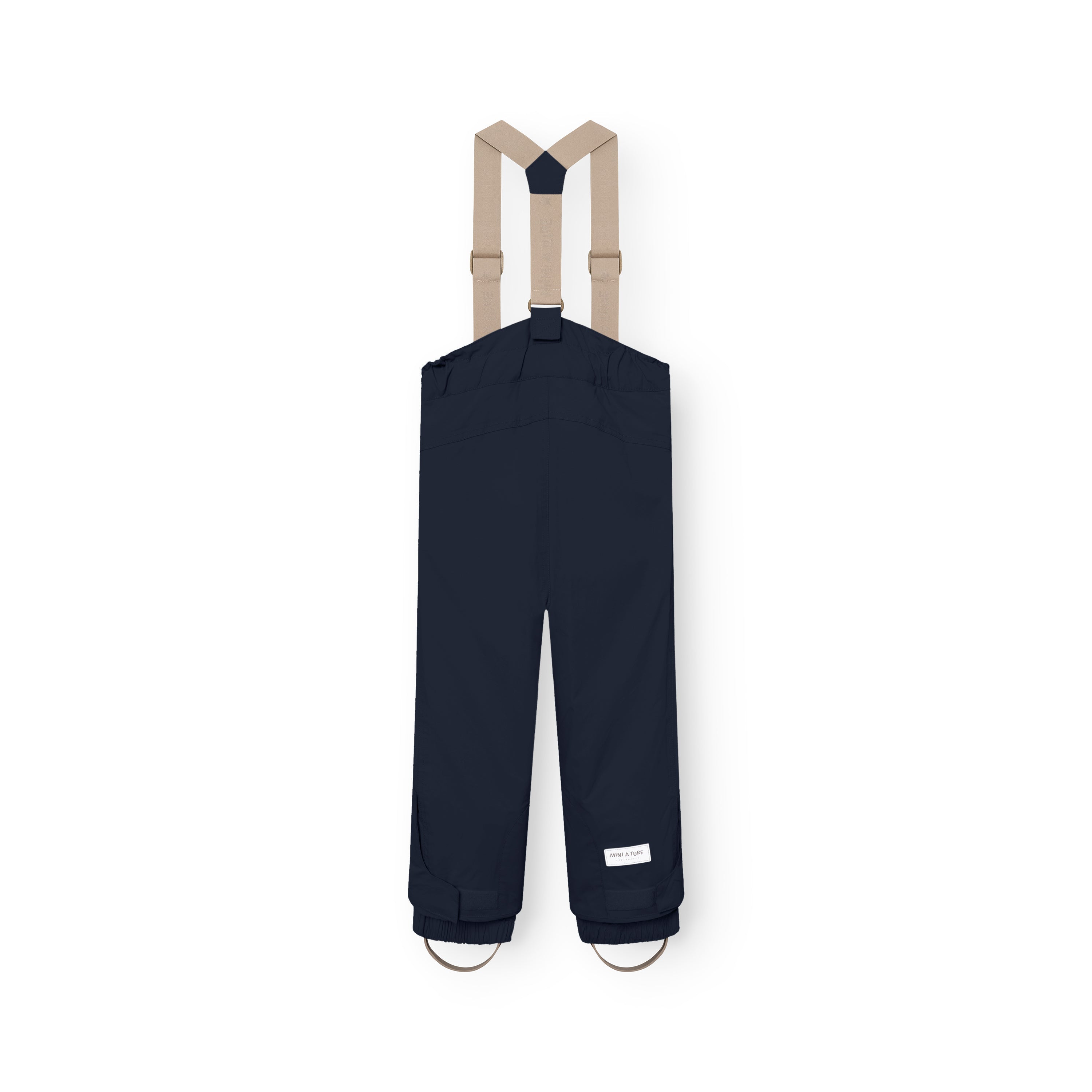 MATWITTE snow pants in navy blue viewed from the back, showing the cross-back elastic suspender attachment, elasticated ankle cuffs with integrated foot straps, and the MINI A TURE label positioned above the reinforced lower leg.