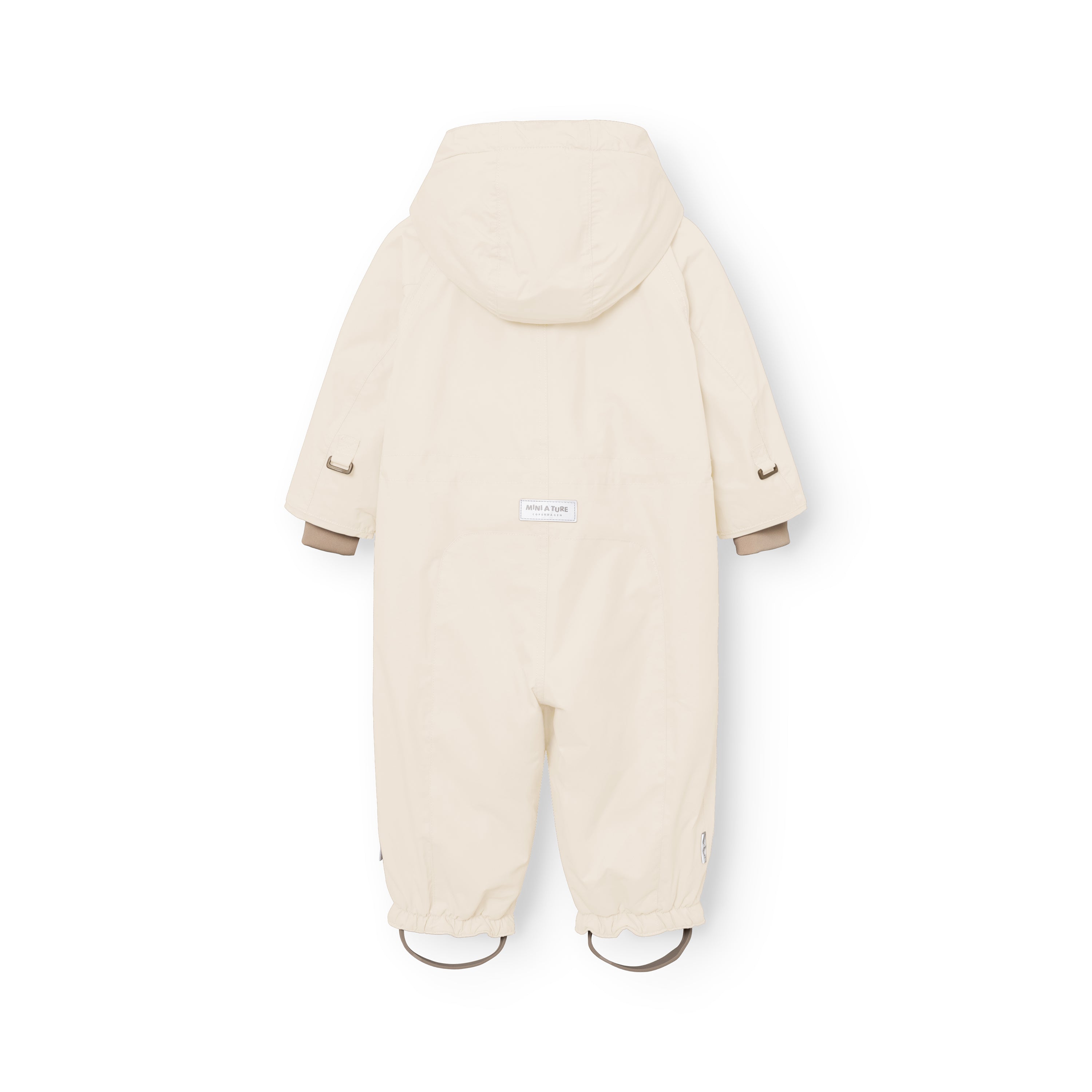 Rear view of the MATWISTI fleece lined snowsuit in warm beige showing the detachable hood, white MINI A TURE label at the lower back, metal D-rings at the sleeve cuffs and elasticated leg openings with adjustable foot straps.