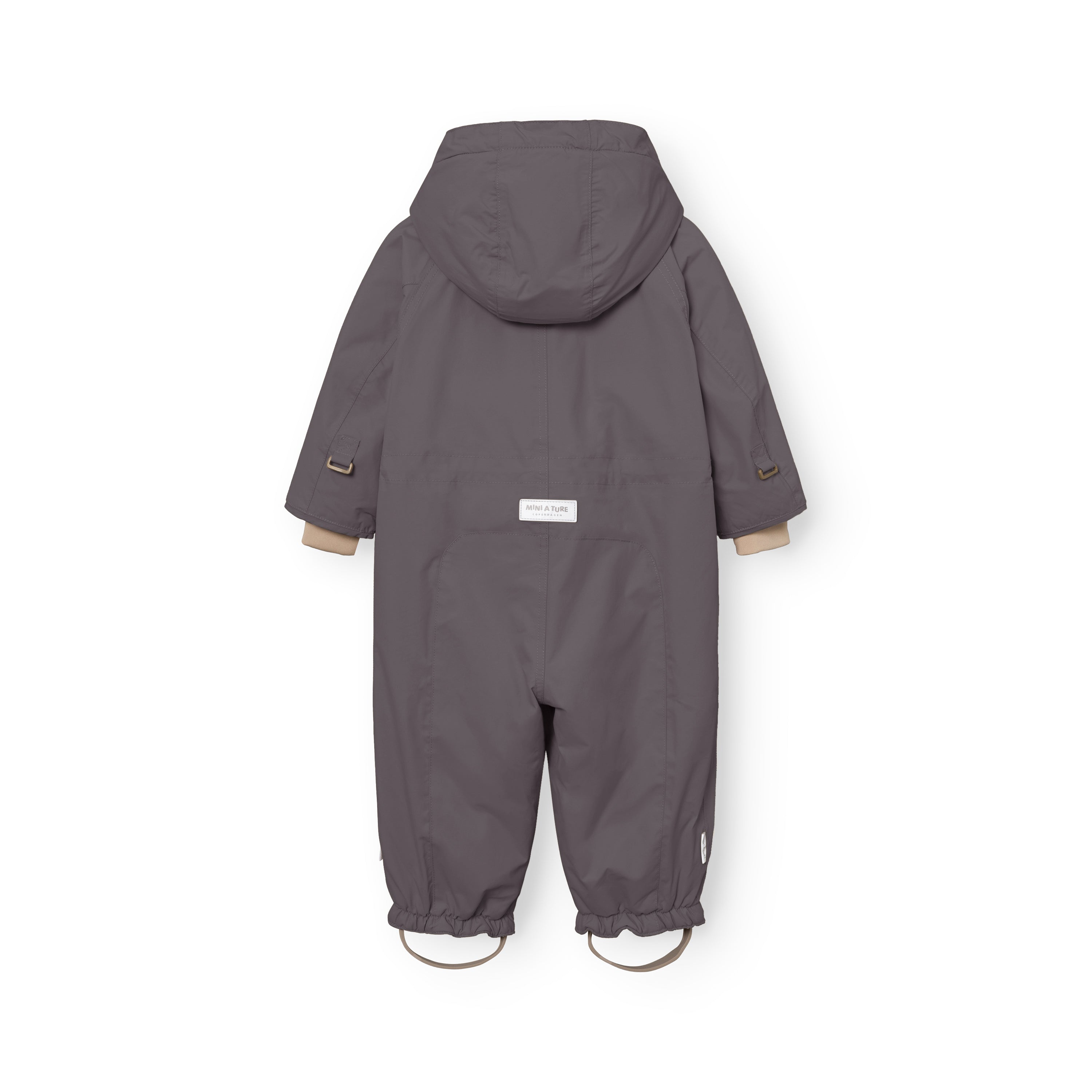 Rear view of the MATWISTI fleece lined snowsuit in charcoal grey showing the detachable hood, MINI A TURE label at the lower back, beige ribbed cuffs at the wrists and elasticated leg openings with adjustable foot straps.
