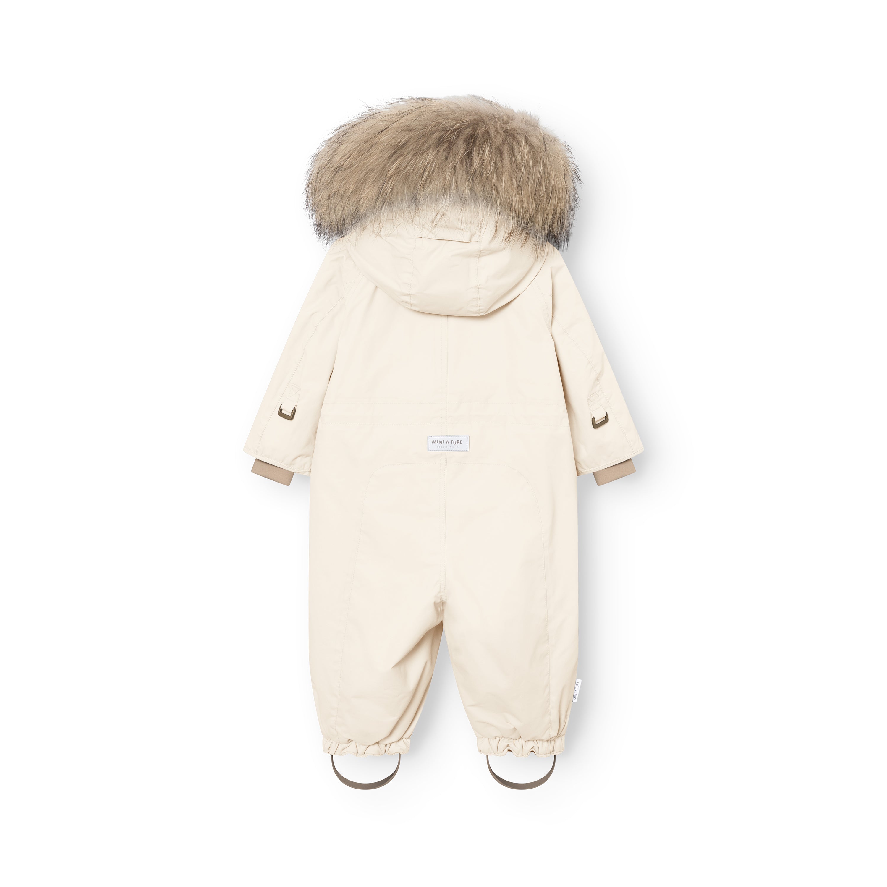 Rear view of MATWISTI fleece lined snowsuit fur in cream with genuine fur-trimmed hood, MINI A TURE label at the lower back, elasticated ankle cuffs with adjustable foot straps, and reflective details on the sleeves.