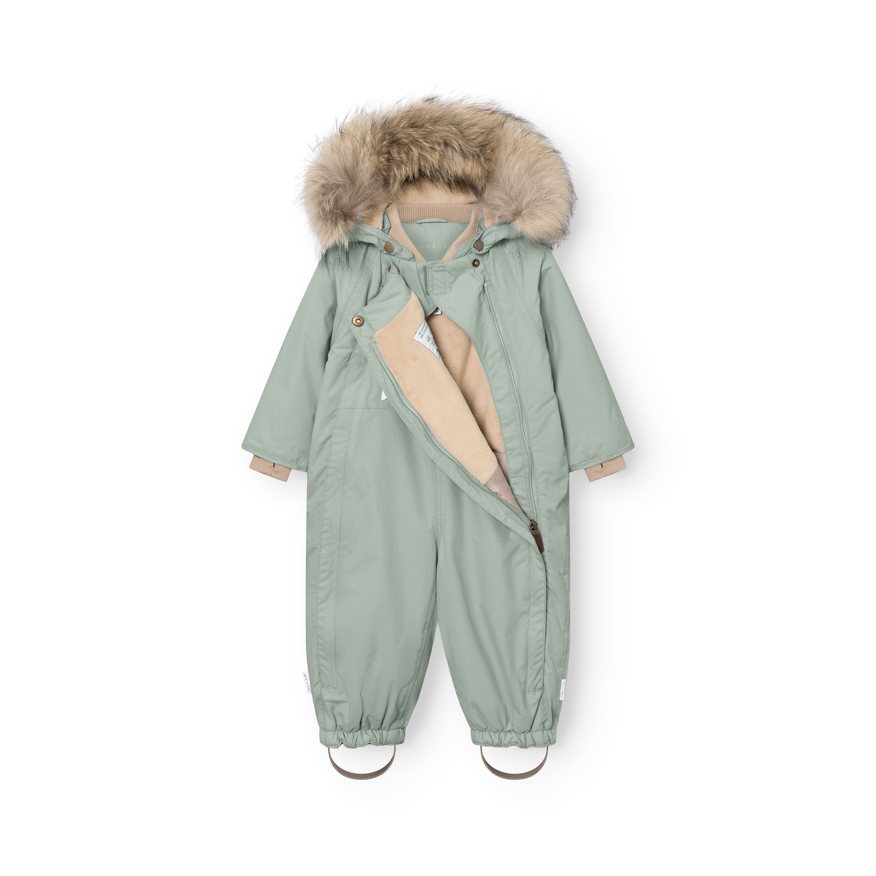 MATWISTI fleece lined snowsuit fur in sage green with one of the two hidden slanted front zips partially open, revealing the beige fleece lining and internal adjustable waist, genuine fur-trimmed detachable hood, taupe ribbed collar and cuffs, and elasticated ankle openings with adjustable foot straps.